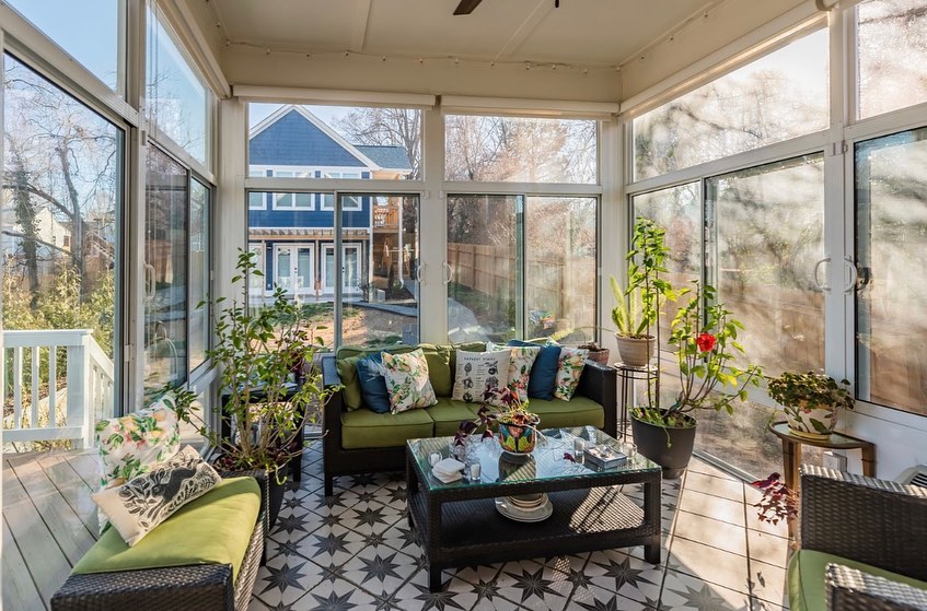 8. Sun-dappled Retreat with Wicker Serenity and Potted Plant Harmony