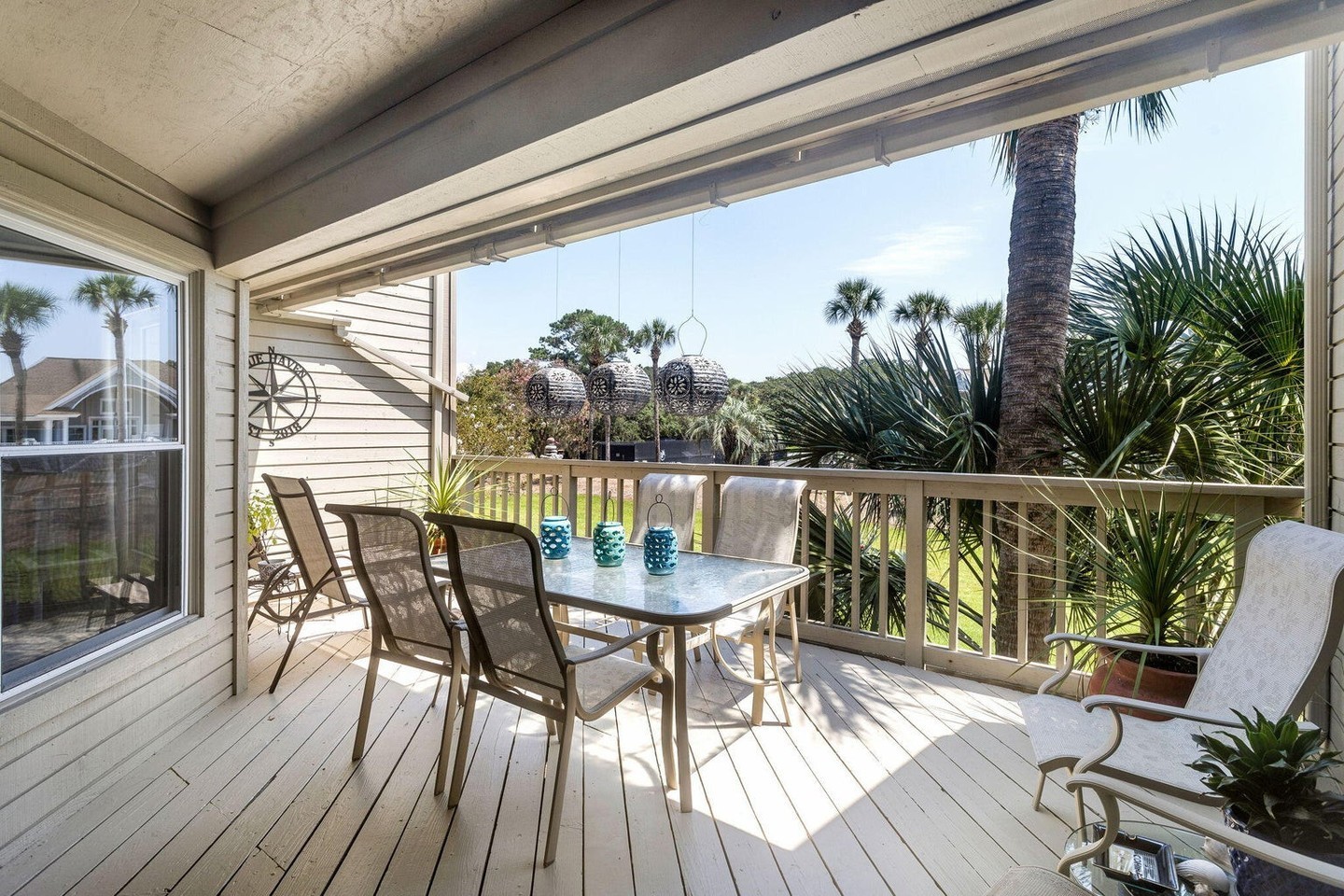 3. Sun-dappled Serenity: Wicker and Wood Fusion In a Glass Enclosure