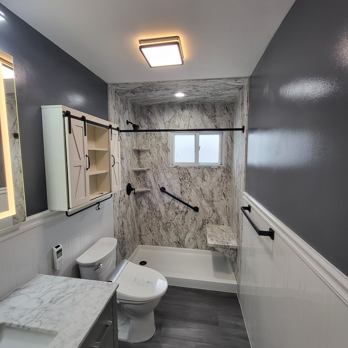 20. Midnight Bloom: Black and White Mosaic Tile Sink with Copper Accents