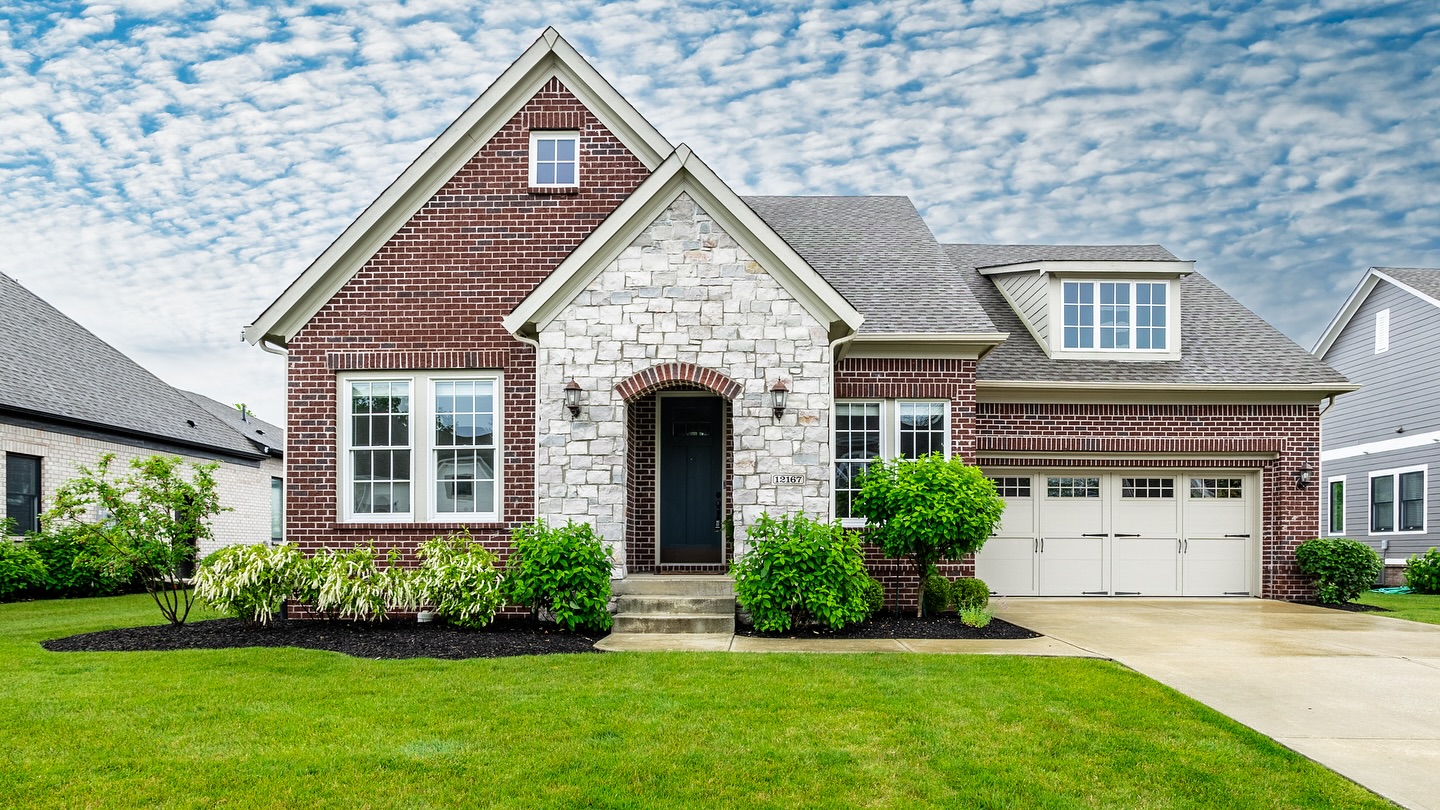 14. a Sunlit Porch with Terracotta Tiles and Climbing Vines on White Siding
