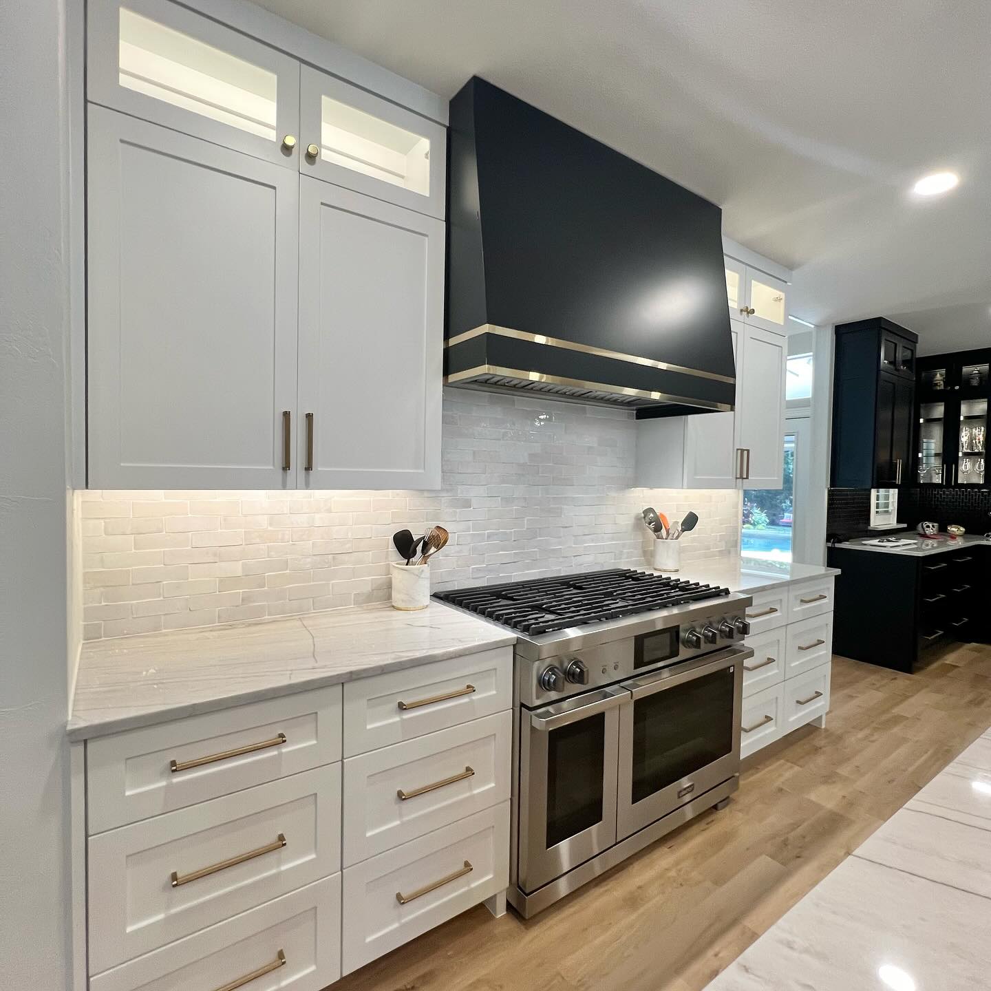 28. a Monochrome Mosaic Of Hexagonal Tiles and Industrial Pendants