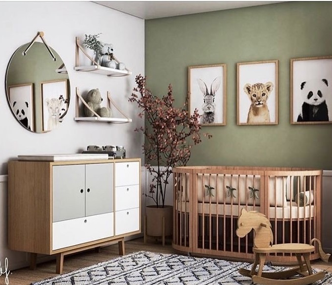 2. Cobalt Blue Accent Wall with Monochrome Mobiles In a Sunlit Nursery