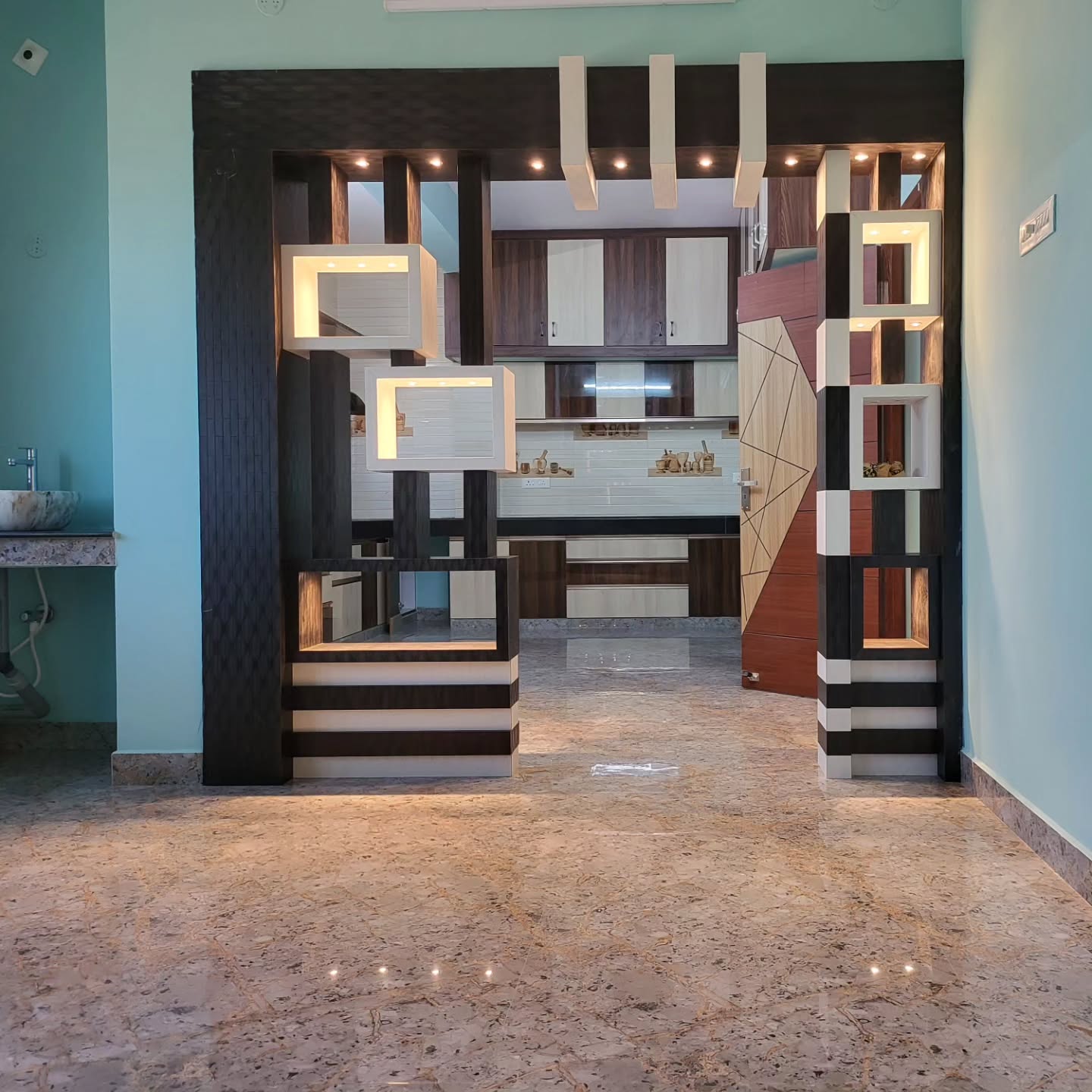 22. Sleek Black Framed Glass Panels with Angular Wooden Accents