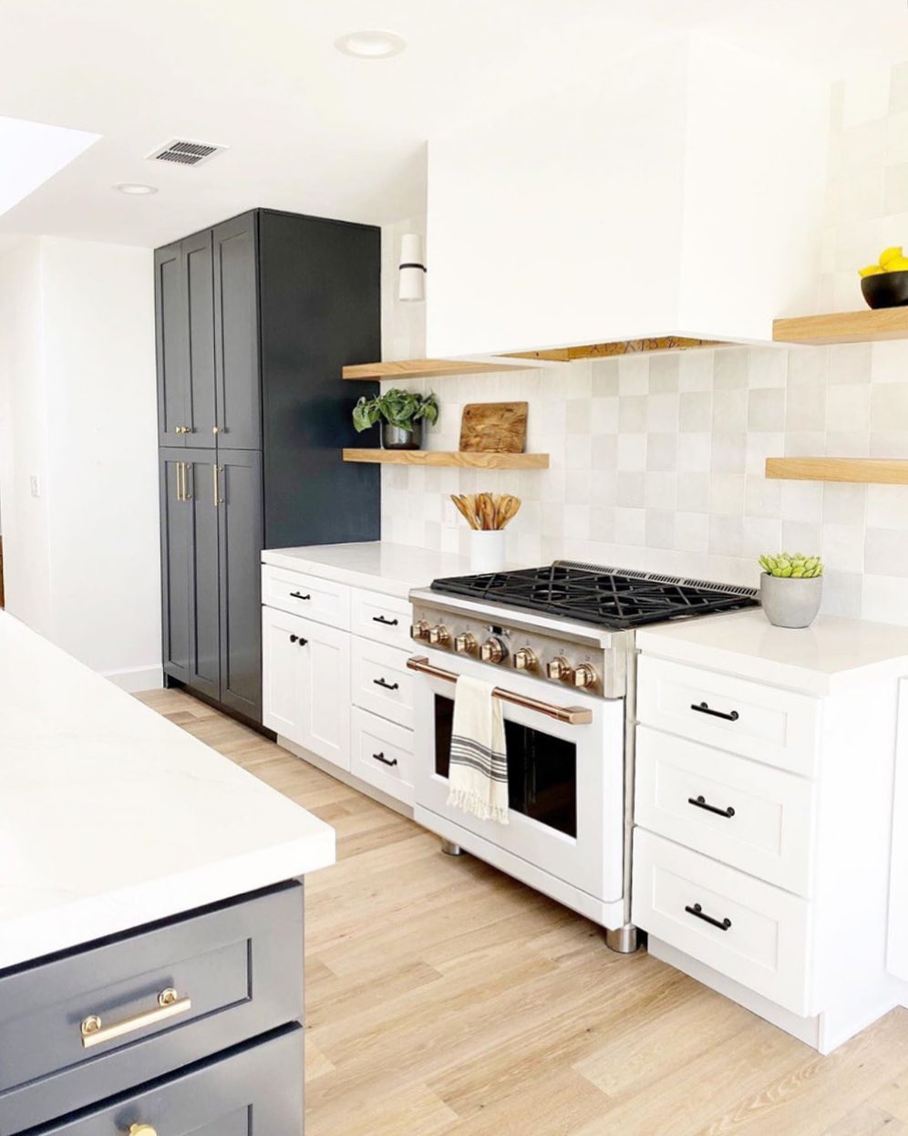 25. White Subway Tiles with Charcoal Grout and Wooden Shelf Accents
