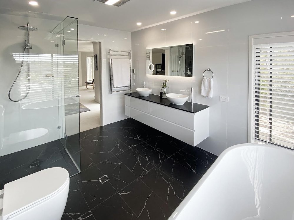 4. Vintage Radiator Meets Minimalist Sink In Monochrome Harmony