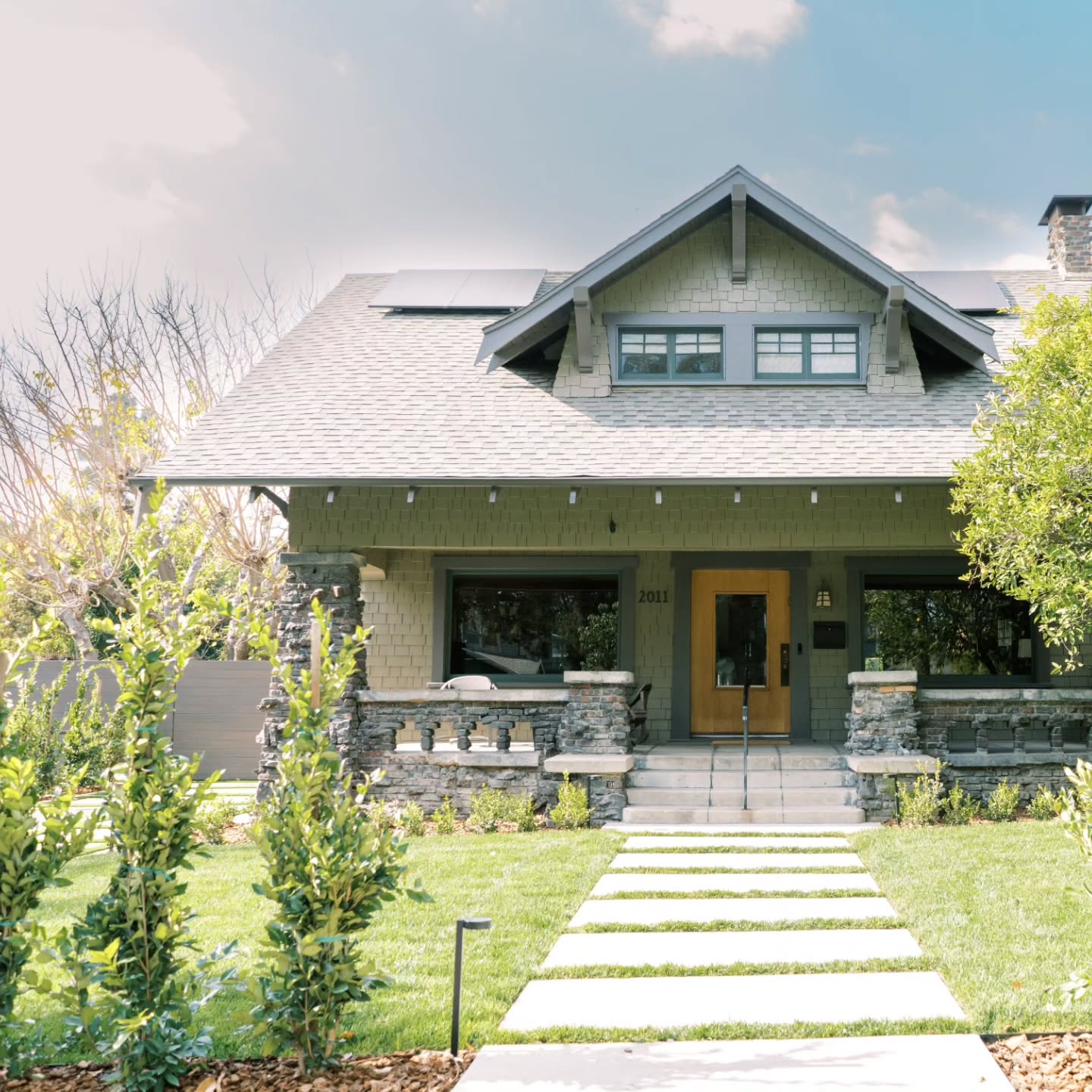 11. a Cobblestone Mosaic Framing a Rustic Wooden Gate