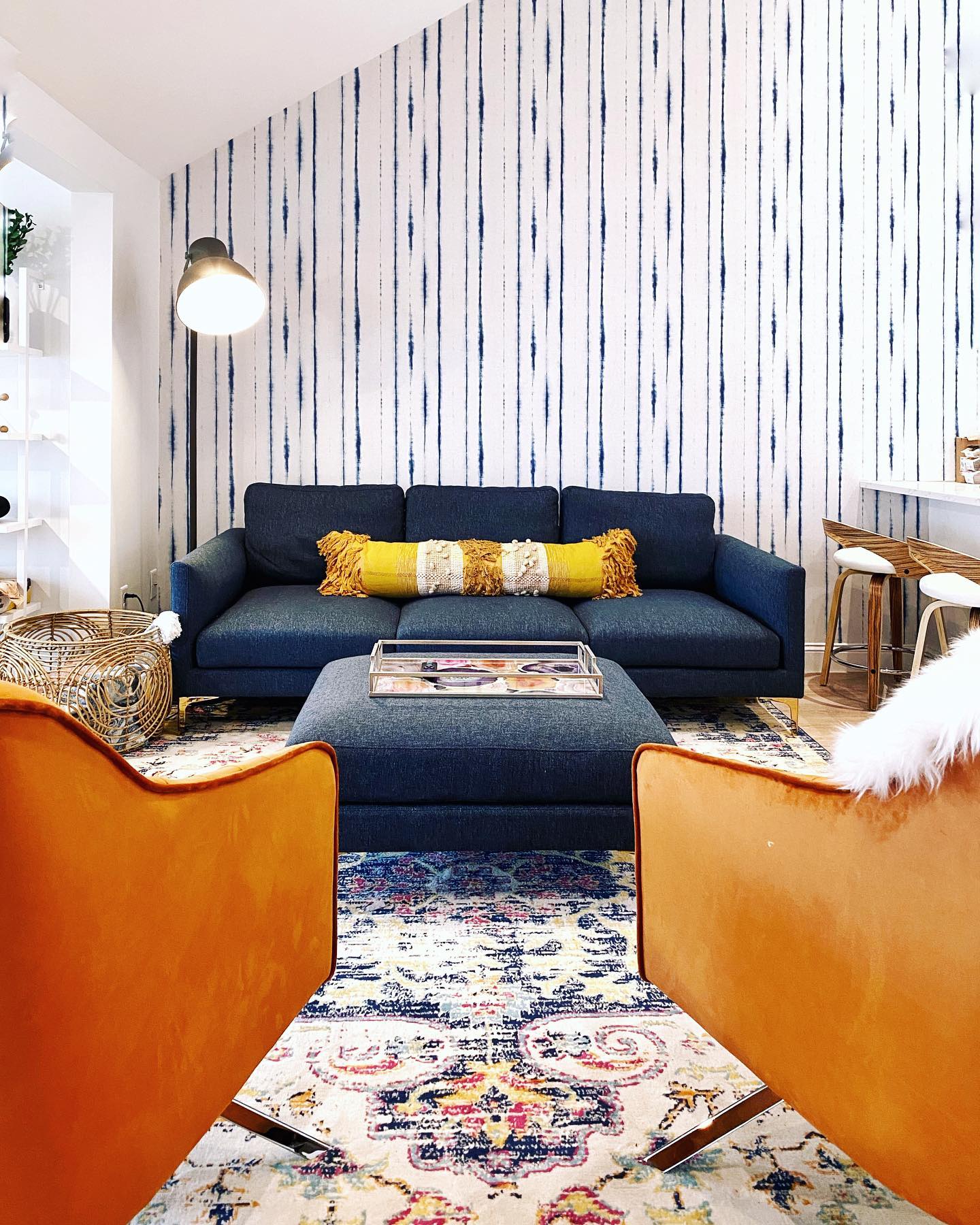 17. Hand-painted Floral Burst on Sunlit Canvas Above a Modern Couch