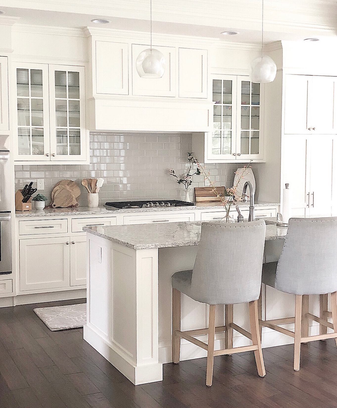 12. White Hexagonal Tiles Meet Wooden Warmth: a Kitchen Backsplash Fusion