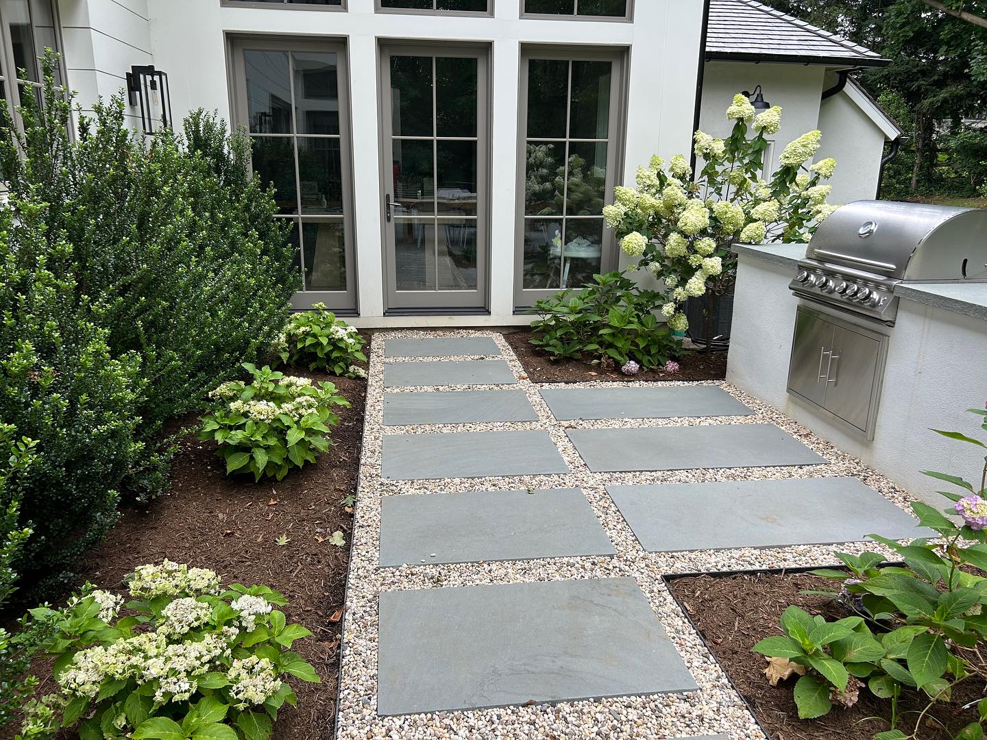 6. a Serpentine Path Of Cobblestones and Mossy Stones Leading to a Rustic Wooden Bench