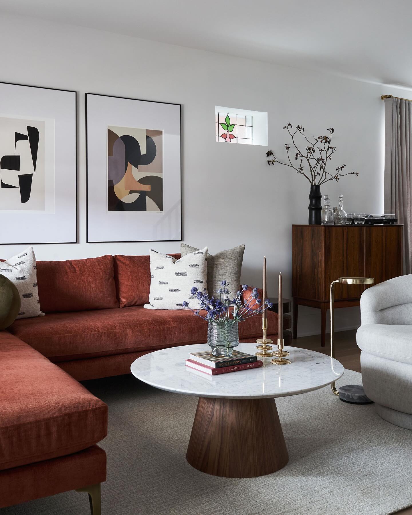 8. Mid-century Modern Living Room with a Suspended Geometric Fireplace and Mustard Velvet Sofa