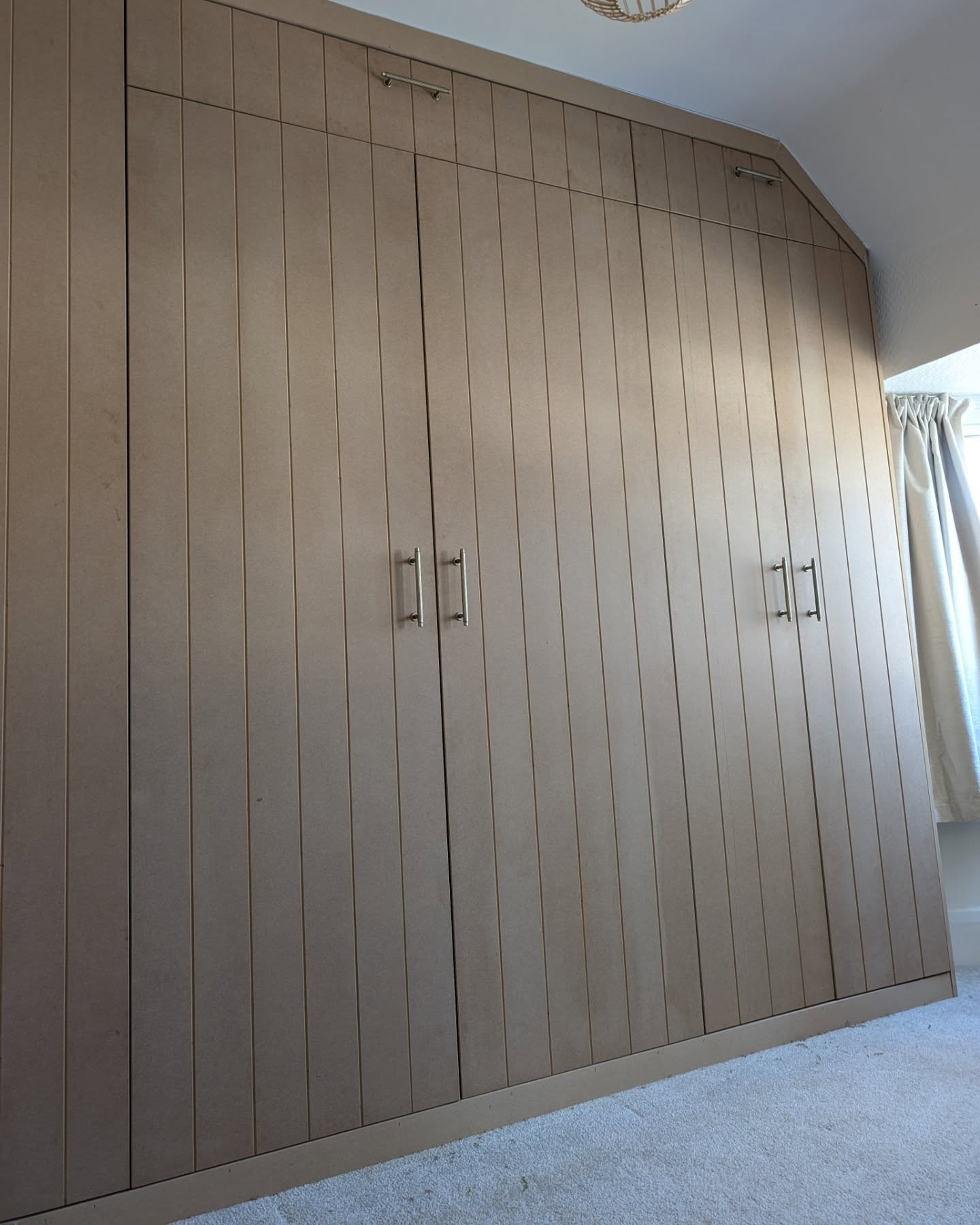 26. Moonlit Glass Panels Illuminate a Hidden Storage Wonderland