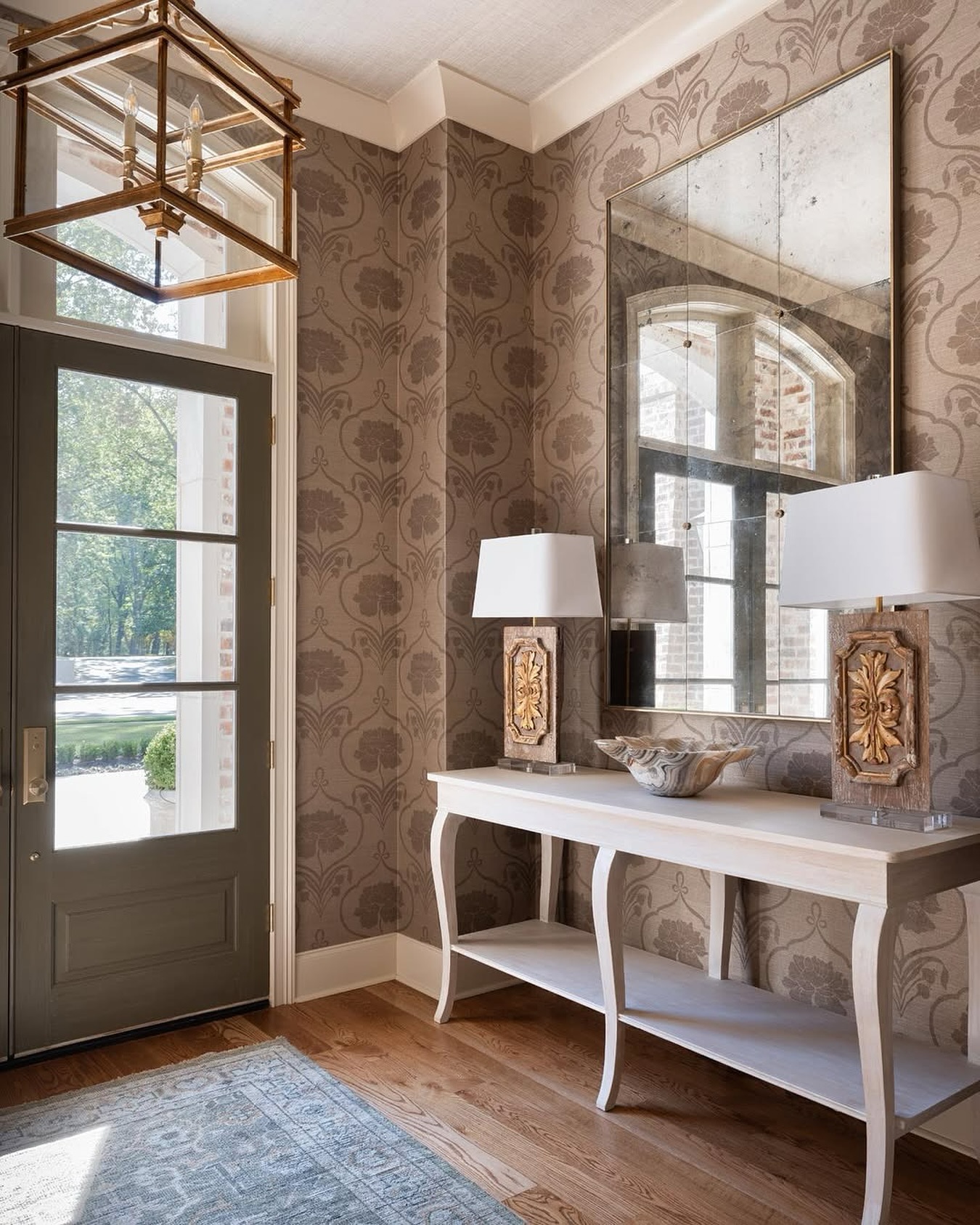 27. Spiraling Ferns and Golden Glow: a Foyer with Nature's Embrace