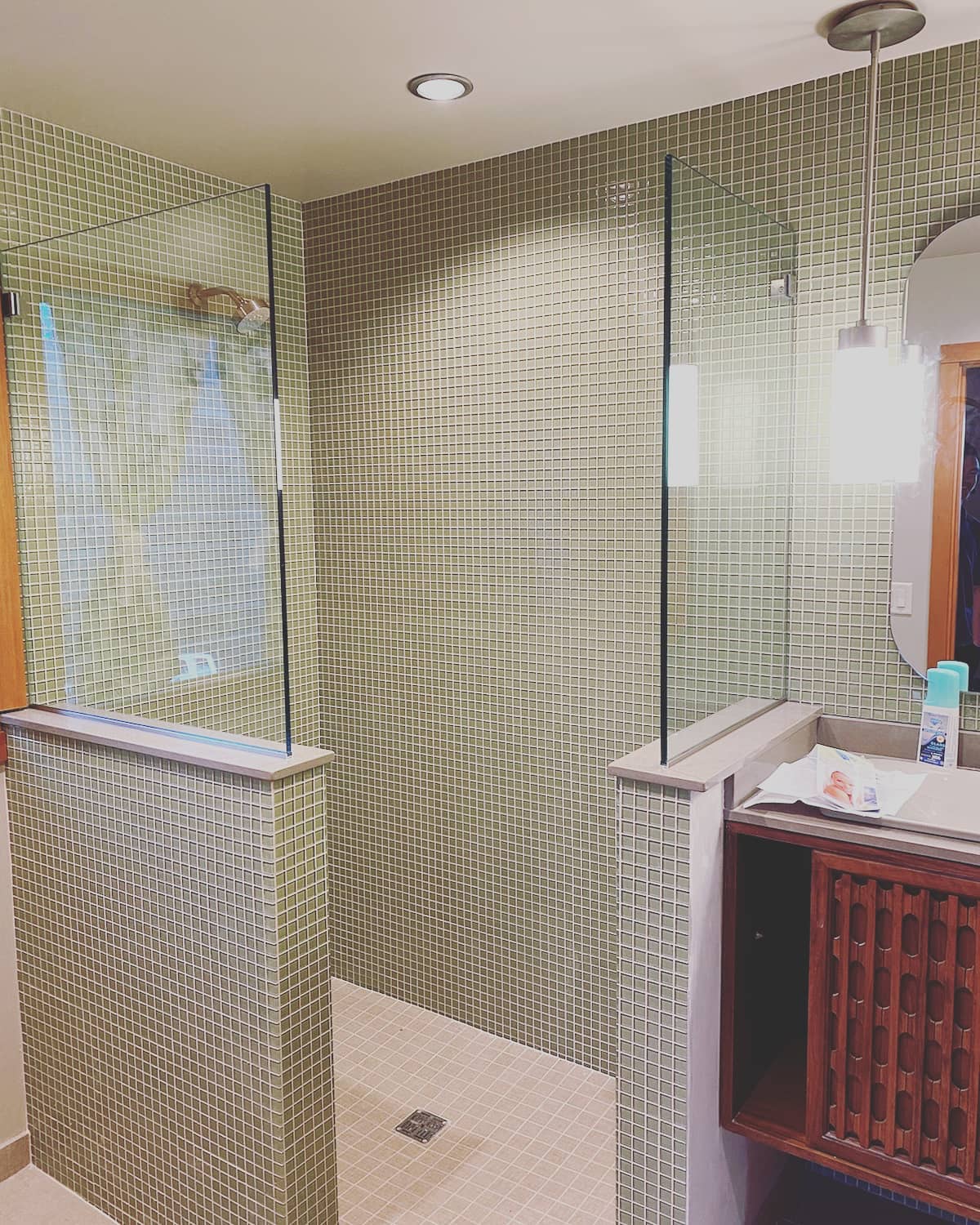 3. Cascading Glass Panels with a Frosted Privacy Accent