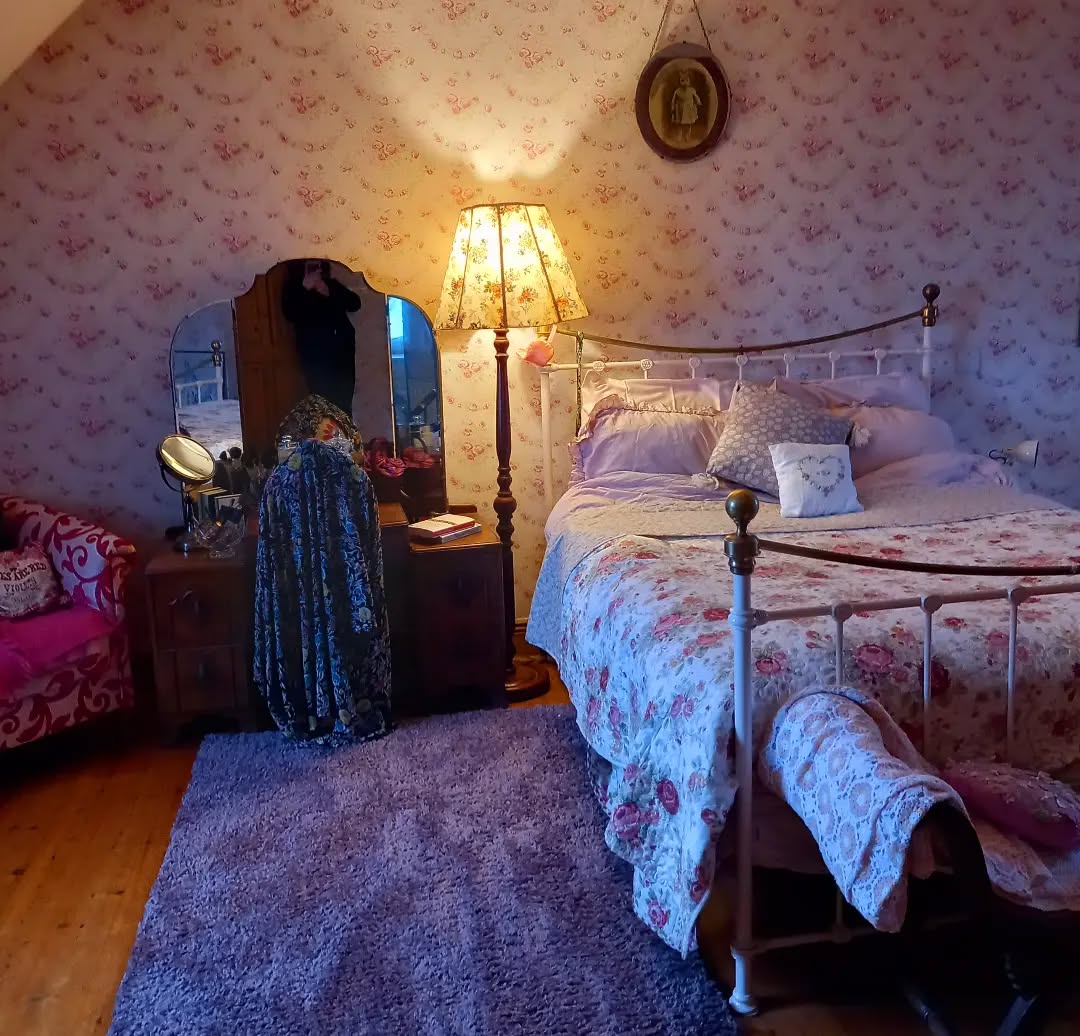 16. Mossy Green Canopy and Wildflower Garland Bedroom Retreat