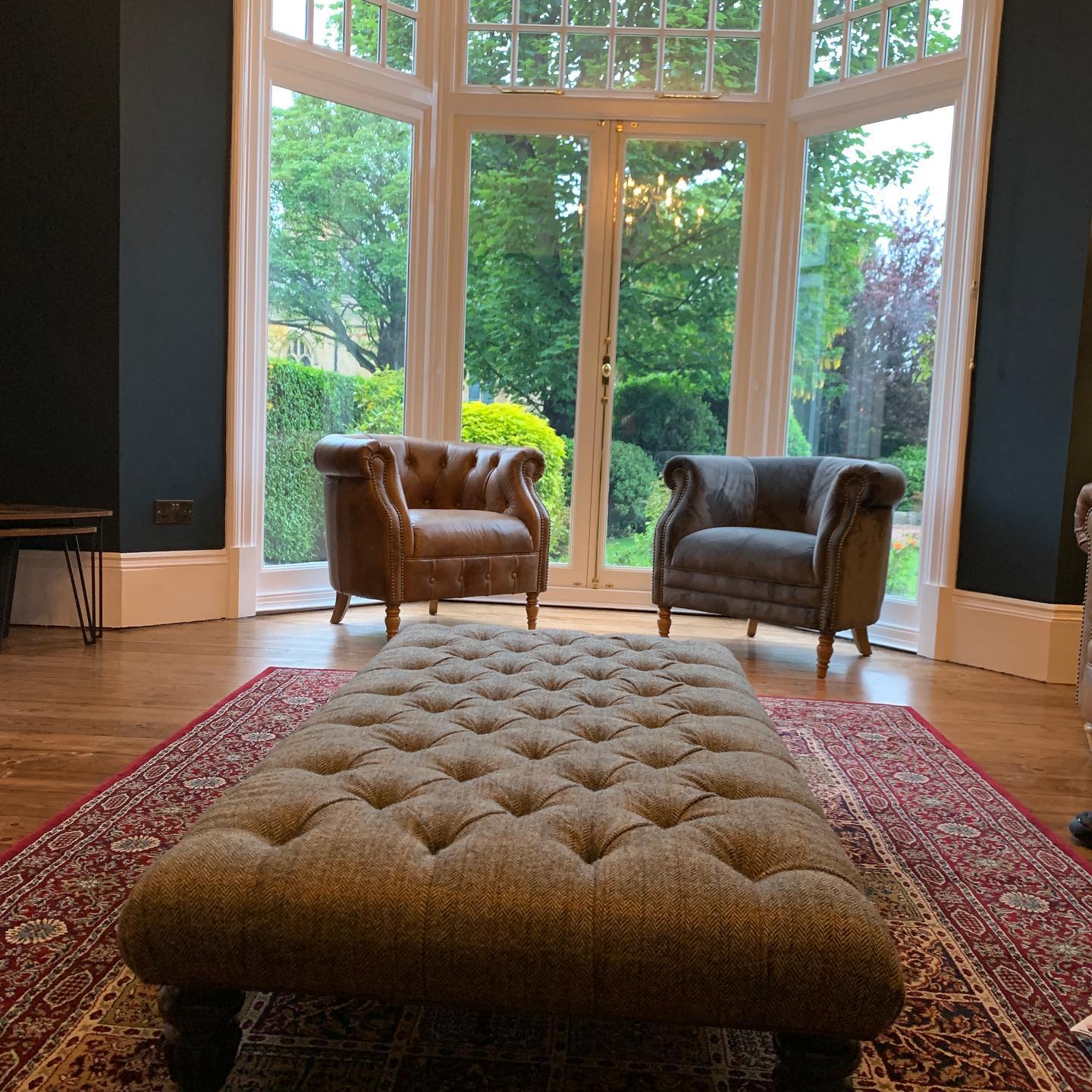 22. Bay Window Bookshelf with Antique Globe and Potted Ferns