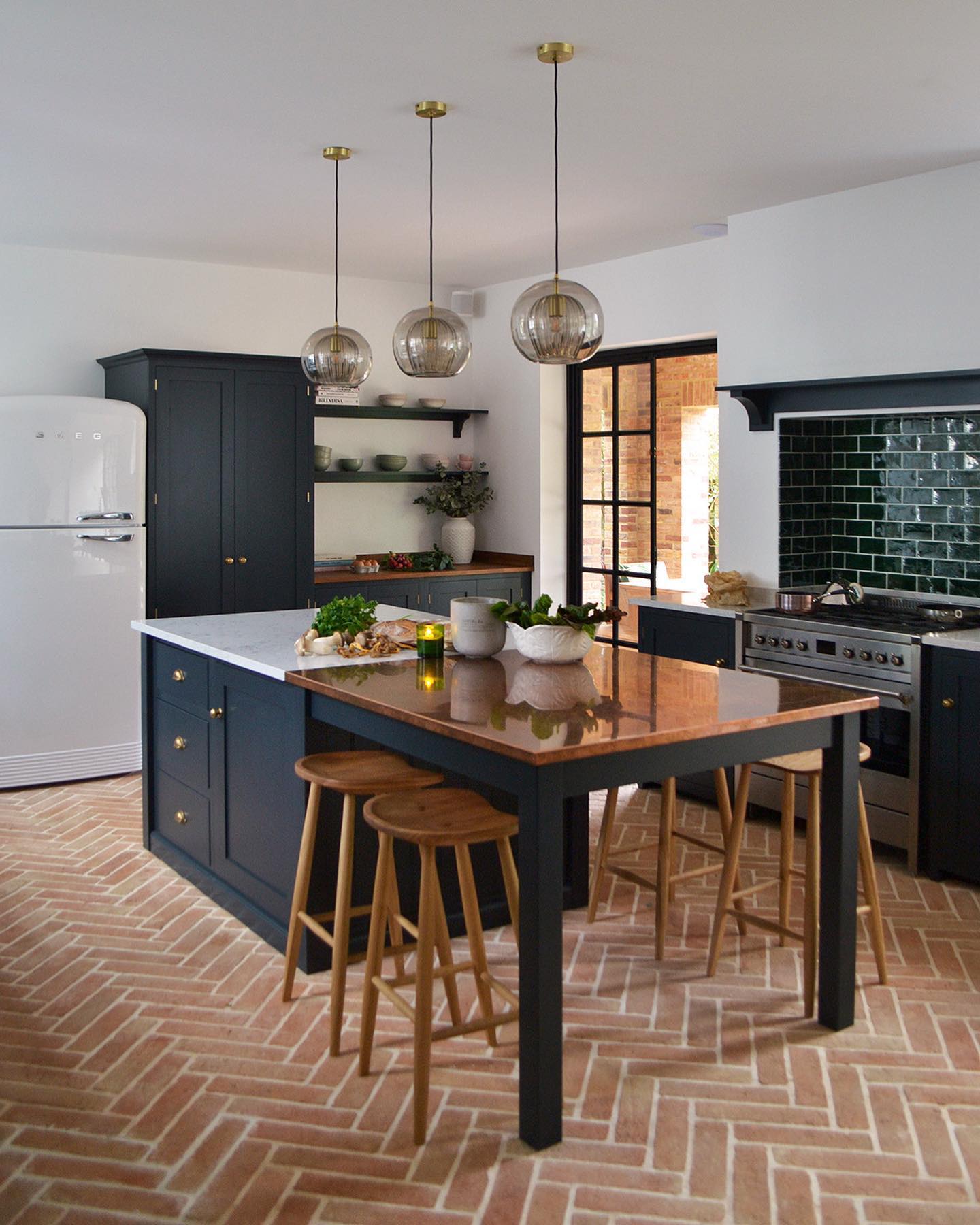 5. Moonlit Marble Meets Industrial Chic: a Kitchen Island with a Suspended Pot Rack