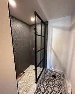14. the Mosaic Tiled Alcove with Brass Accents and a Vintage Bench