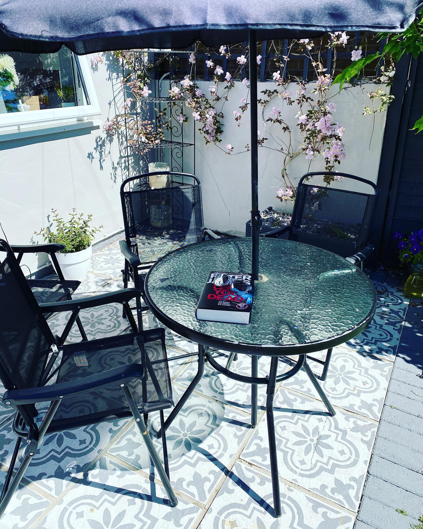 5. Vintage Bicycle Planter with Sunlit Yellow Flowers on Rustic Wooden Deck