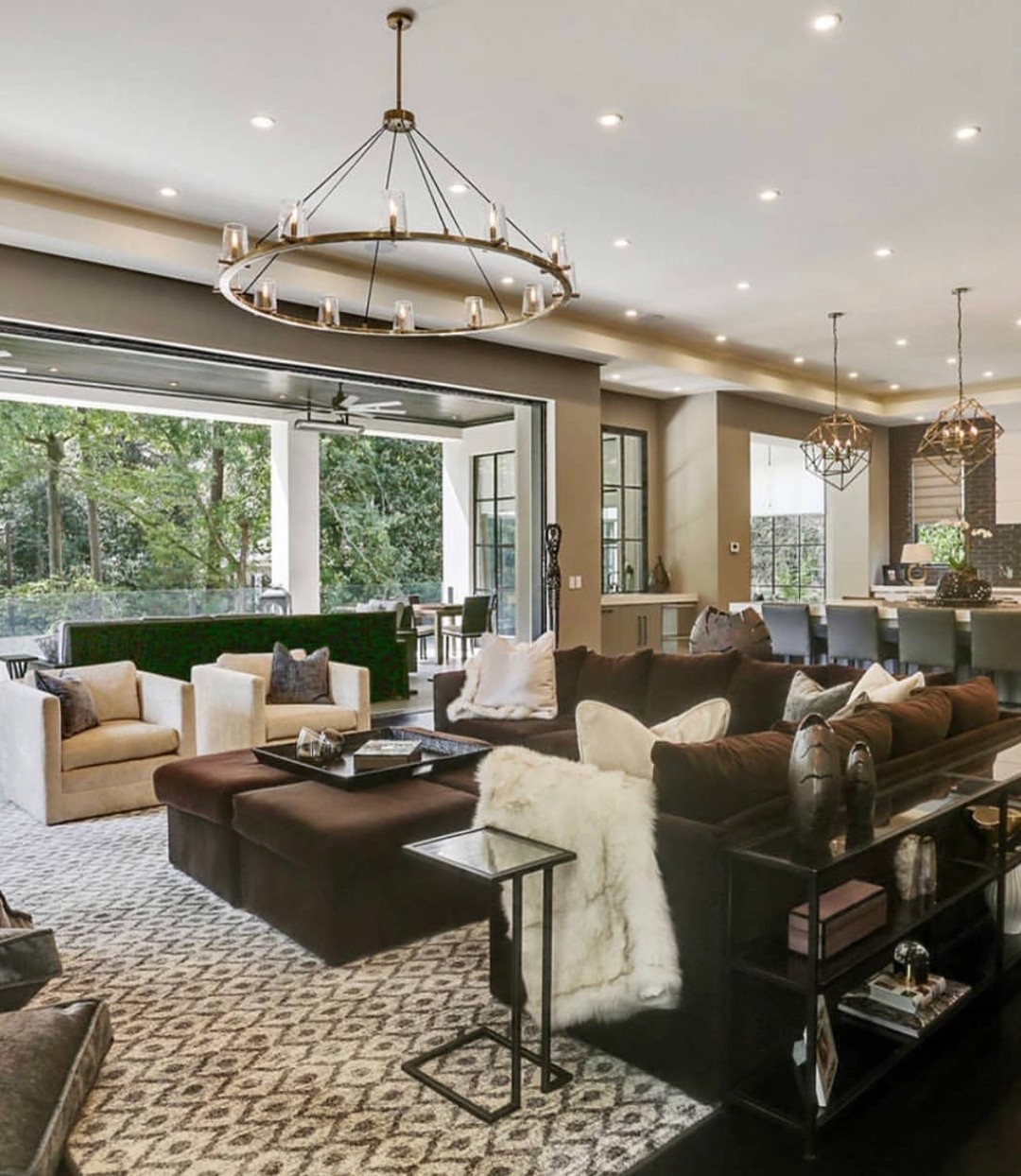 35. the Crimson Armchair Anchored by Geometric Rugs In a Sunlit Nook