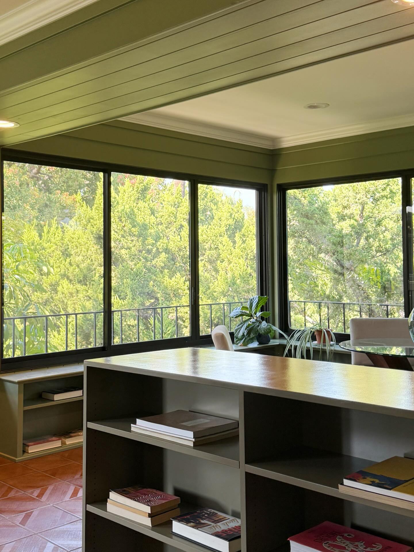 10. Sunlit Serenity: Bamboo Accents and Wicker Comfort In a Glass-enclosed Retreat