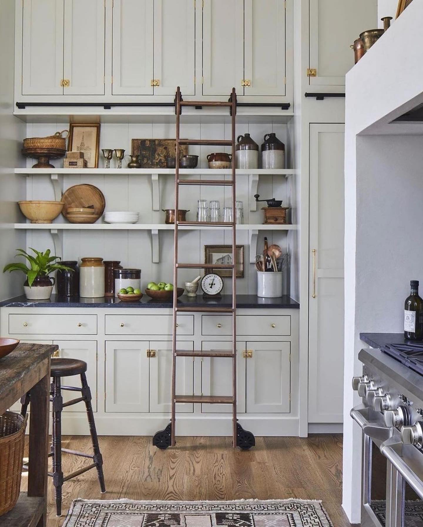 14. Antique Clock and Copper Pots on a Dusty Pink Wall Shelf