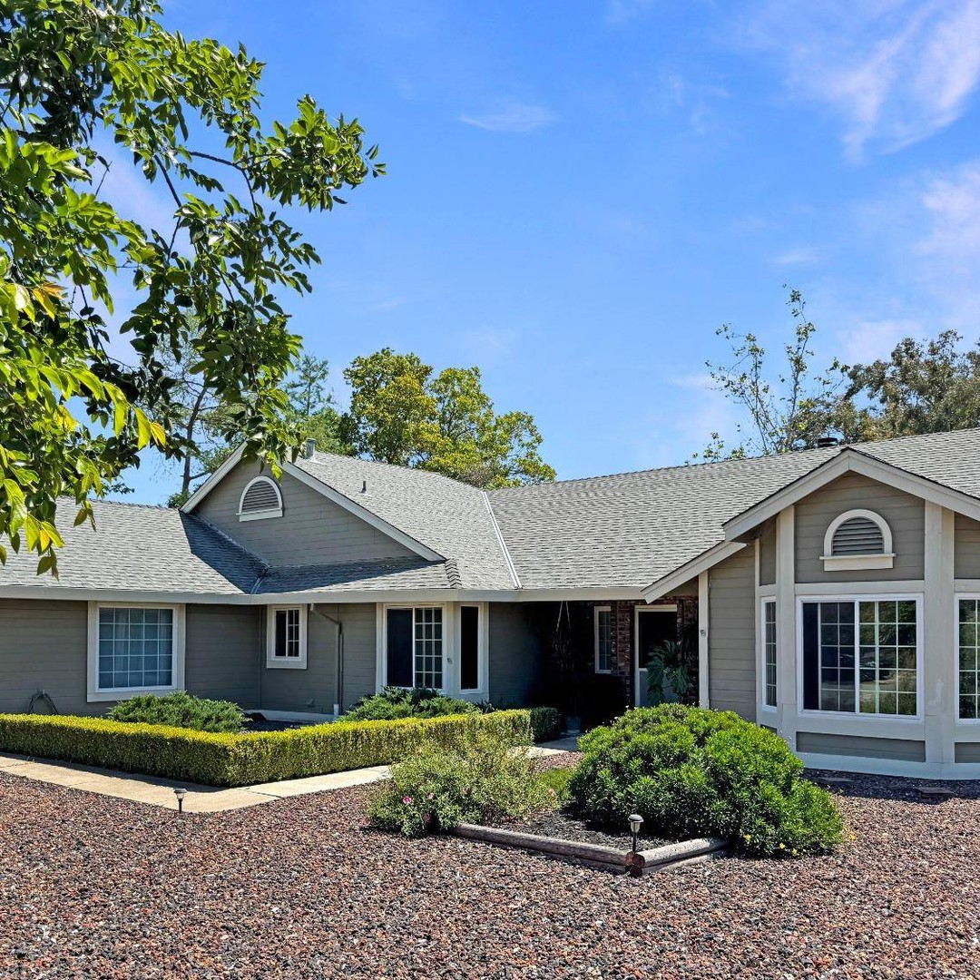 3. the Adobe Red Stucco Facade with Geometric Window Panes and Cobalt Blue Accents