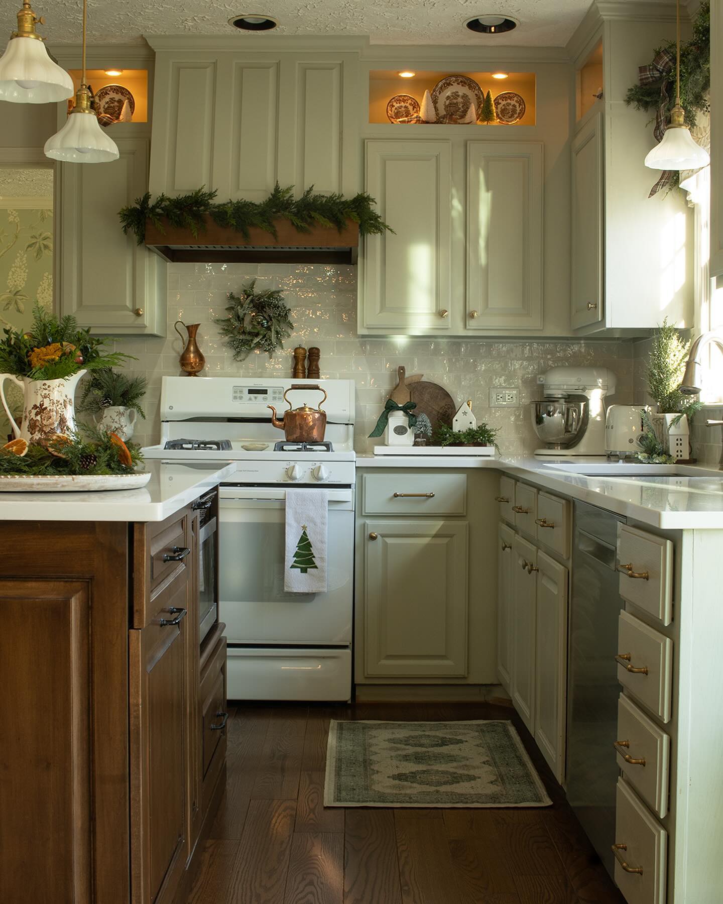 5. Festive Red Mittens Hanging from a Gingerbread Man Garland Above a Stove
