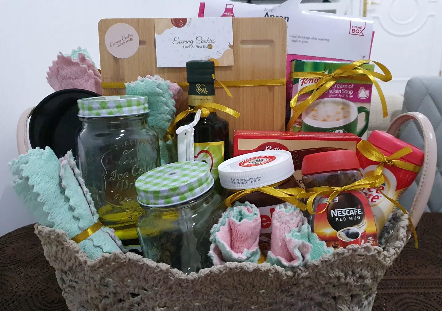 2. Vibrant Red Utensils Amidst a Sea Of Greens In a Rustic Basket