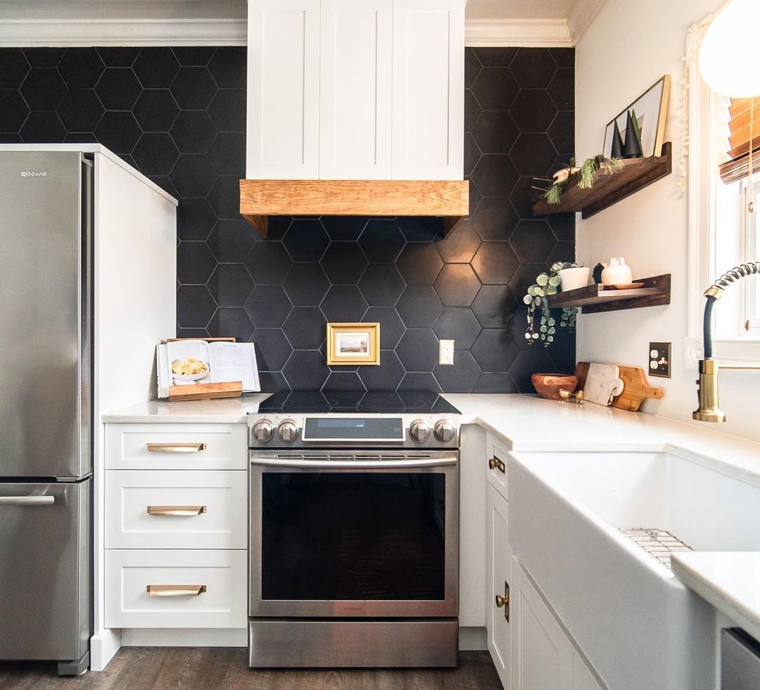 11. Black and White Mosaic Backsplash with Industrial Piping Accents