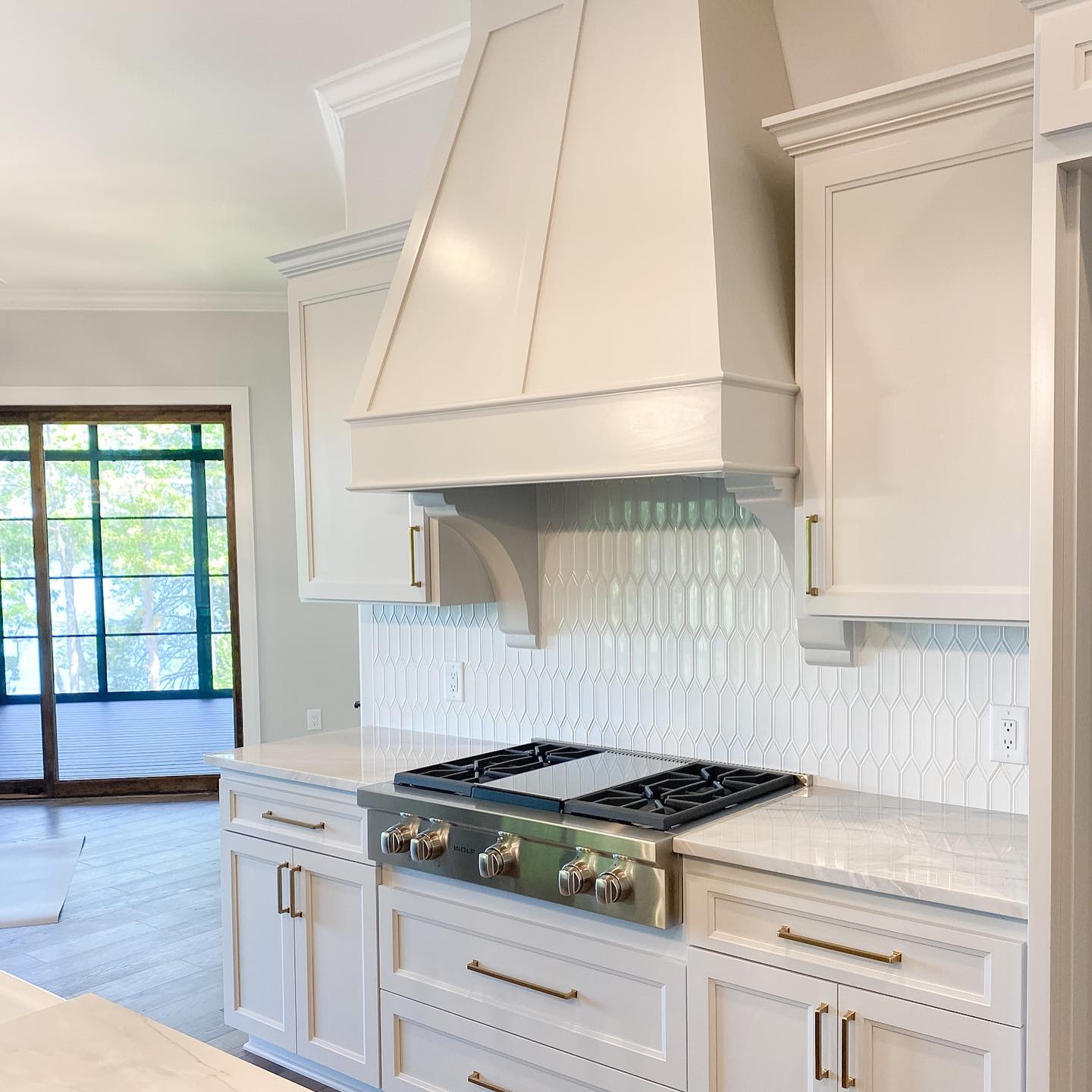 1. White Subway Tiles Meet Geometric Mosaic Accents In a Harmonious Kitchen Backsplash