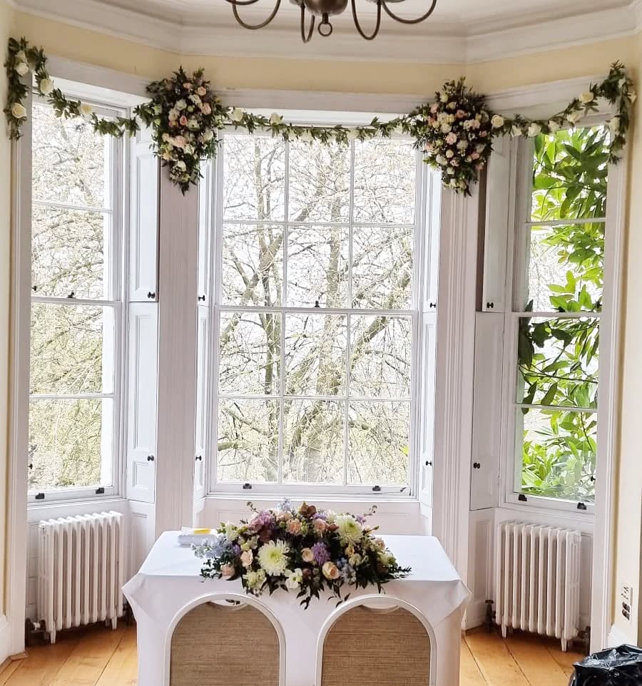 37. Sunlit Serenity: a Bay Window Nook with a Vintage Brass Telescope and Lush Potted Plants