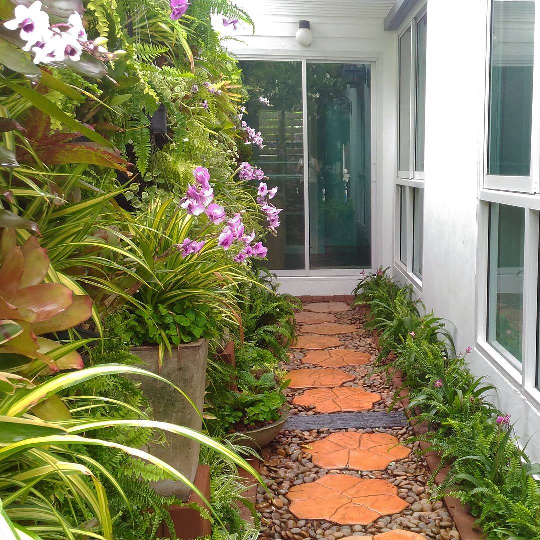 2. River Stones Cascading Over a Tiered Wooden Bench with Mossy Accents