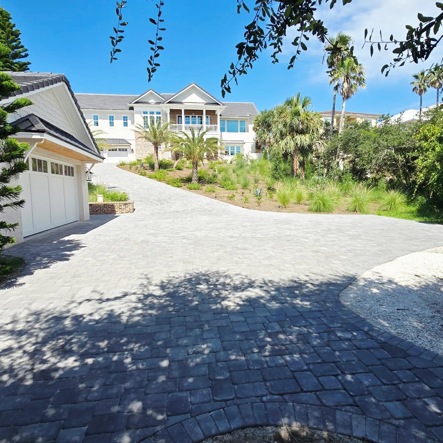 14. Cobblestone Pathway Flanked by Lush Ferns and Solar Lanterns