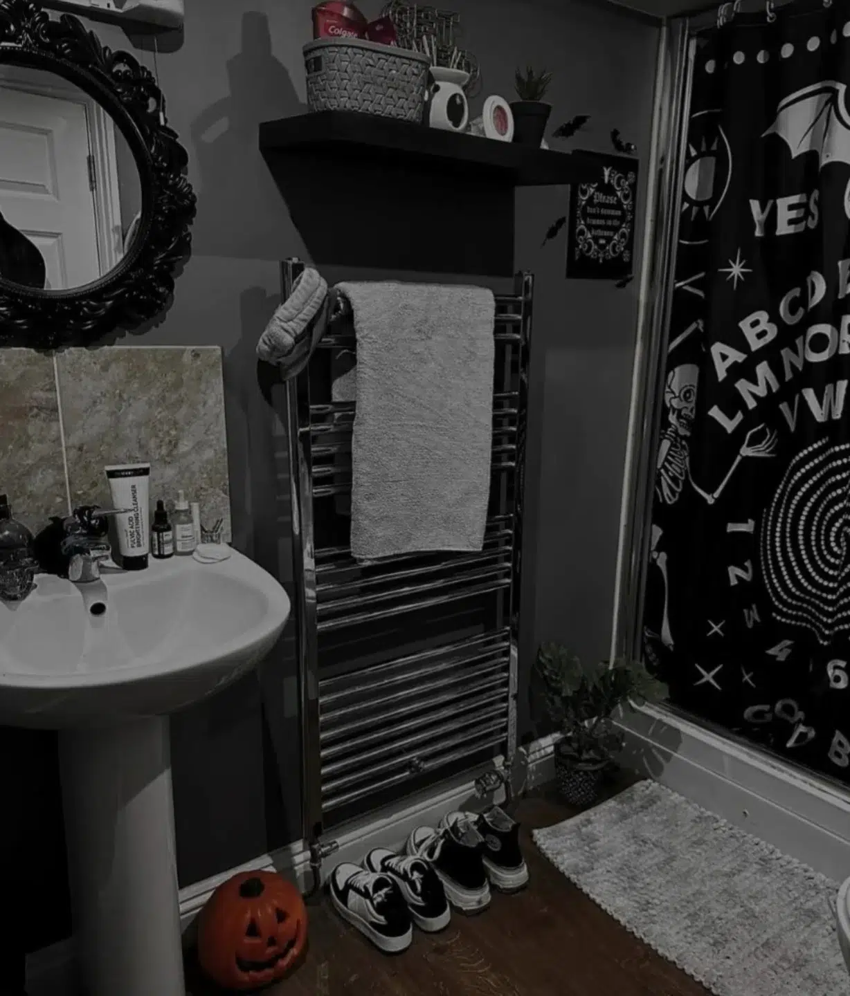 11. Cobweb Curtains and Cauldron Sink In a Moonlit Bathroom Retreat