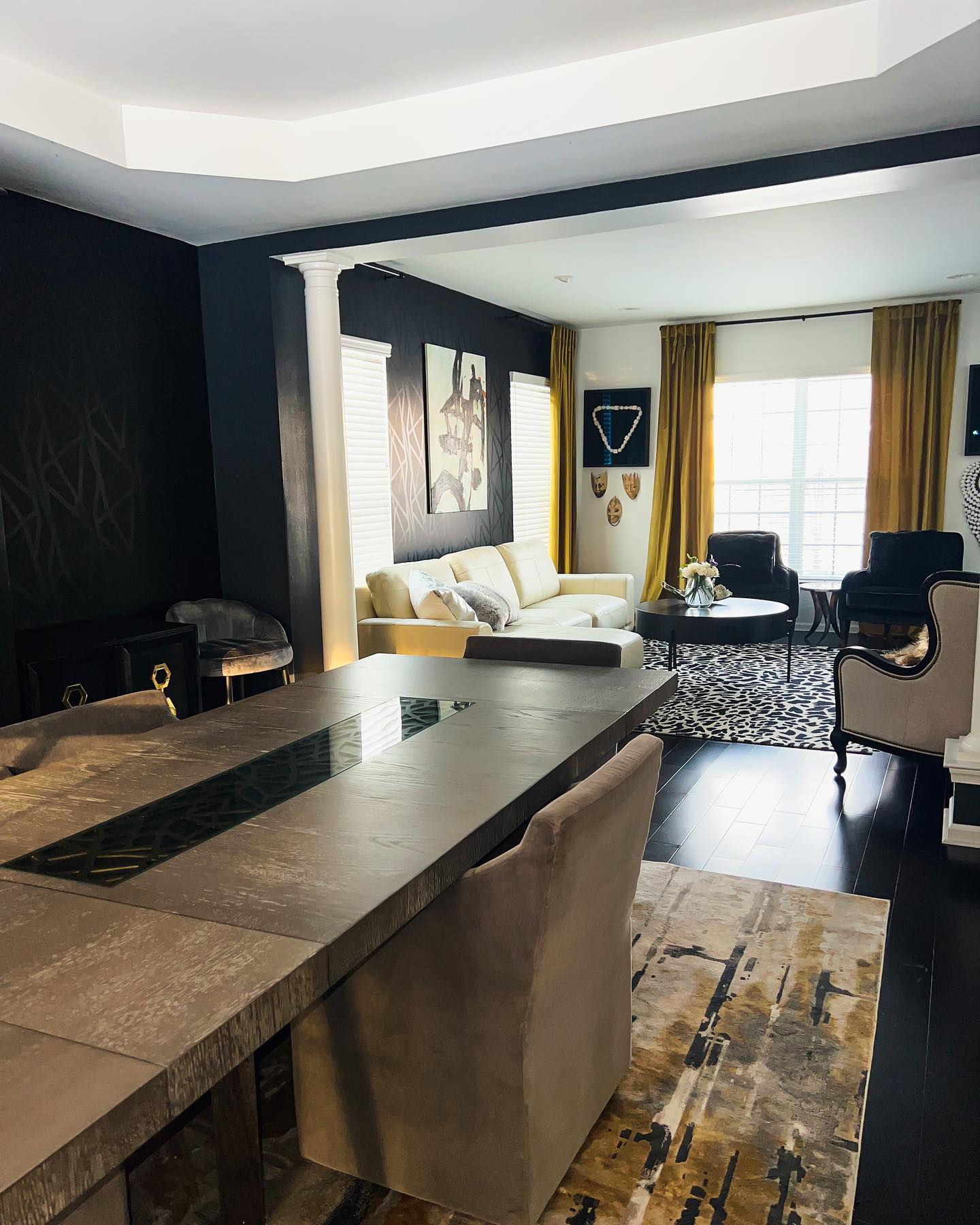 37. the Crimson Velvet Sofa with Geometric Wall Art and Floating Shelves