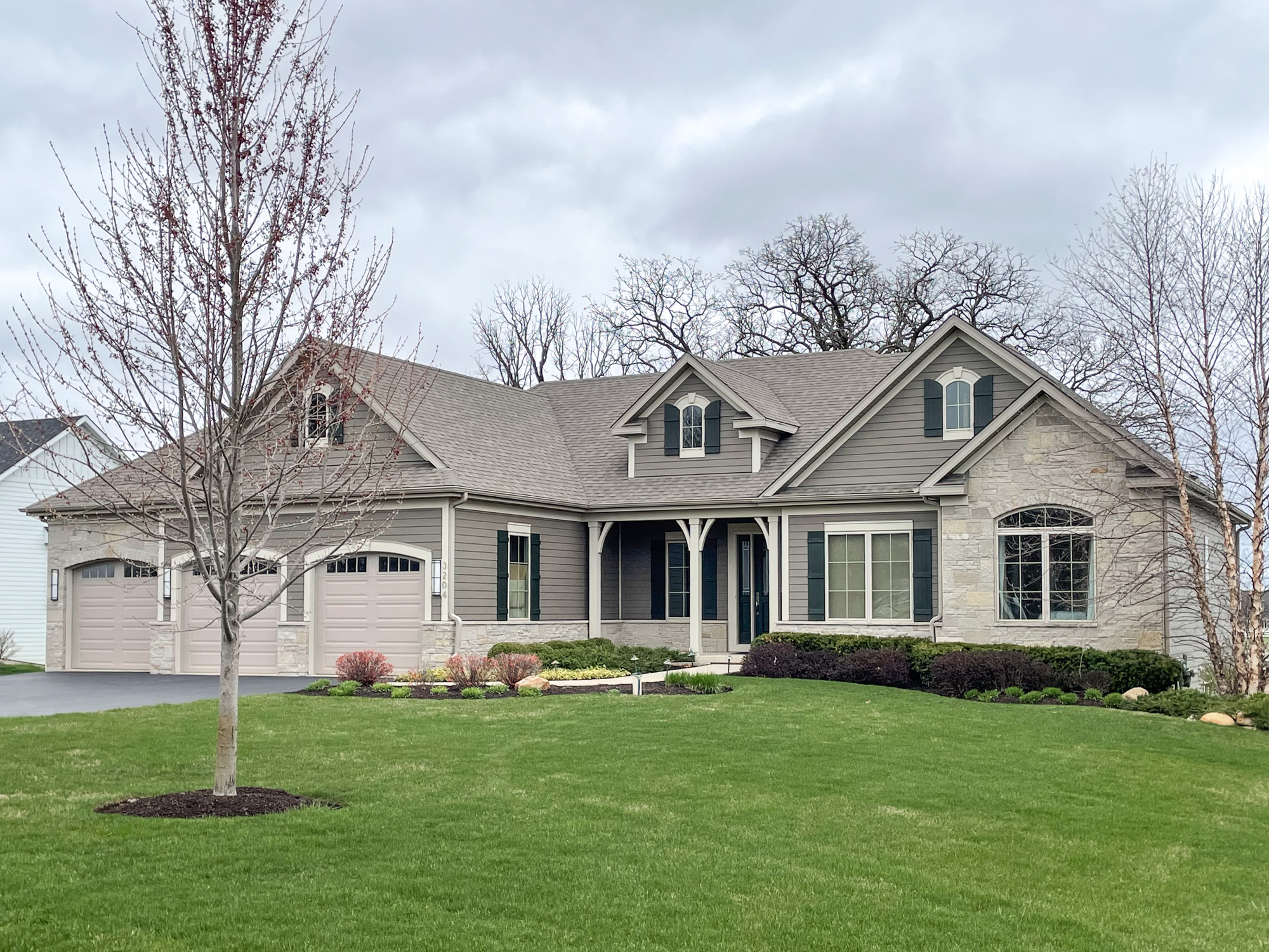 25. the Adobe Red Siding with Cobalt Blue Shutters and Sunlit Porch