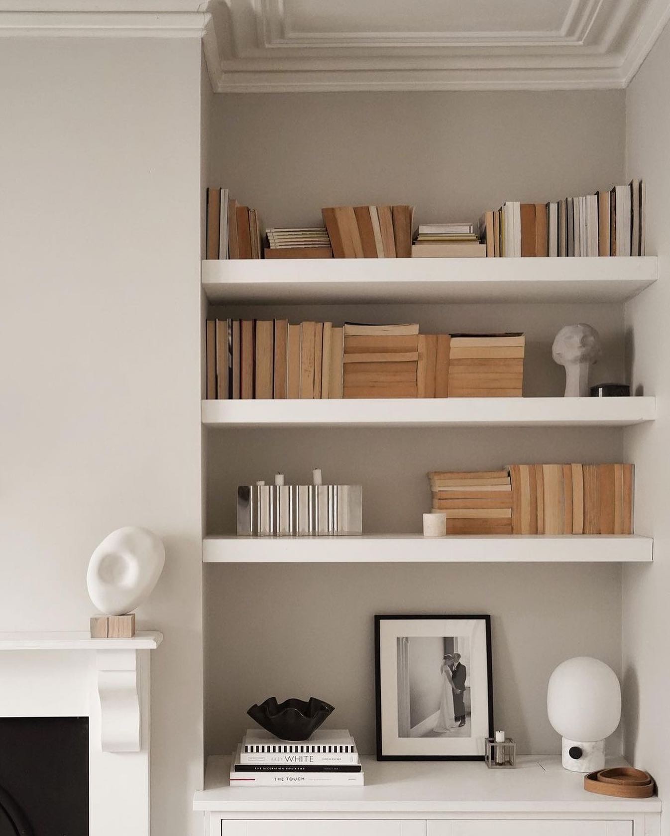 18. Cascading Book Vines and Geometric Shadows on a Sunlit Wall