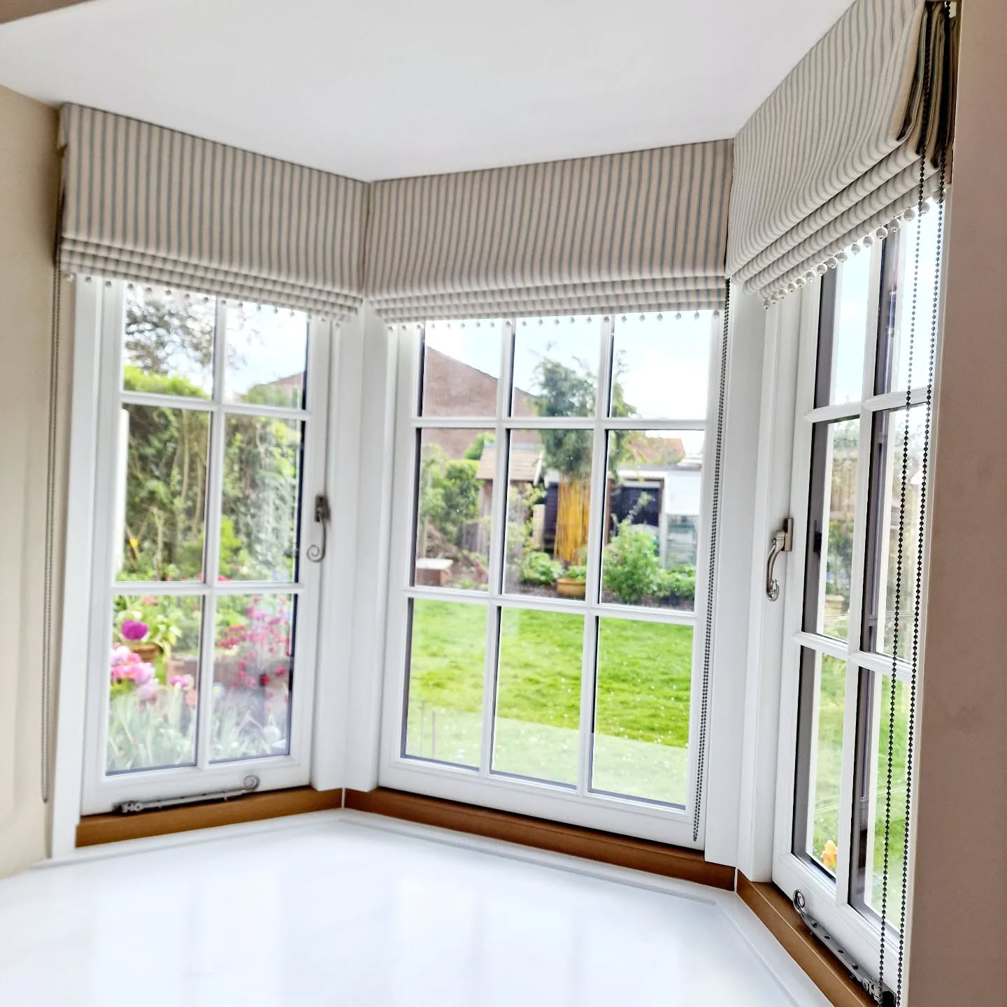 23. Bay Window with a Kaleidoscope Of Green Botanicals and Vintage Charm