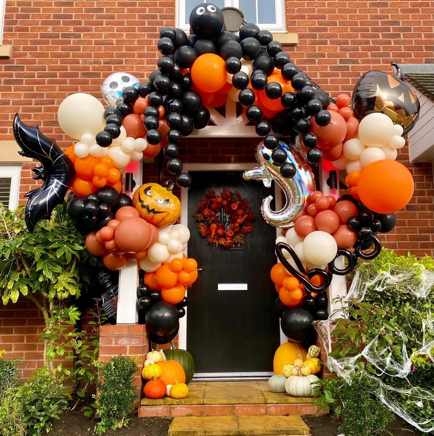 9. Spooky Silhouette Of a Witch Riding a Crescent Moon Door Hanger