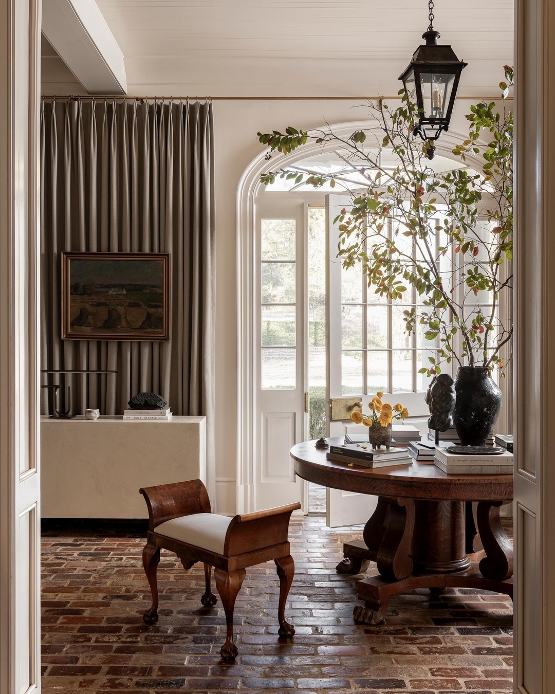 35. Velvet Curtains and Geometric Tiles: a Foyer's Dance Of Textures