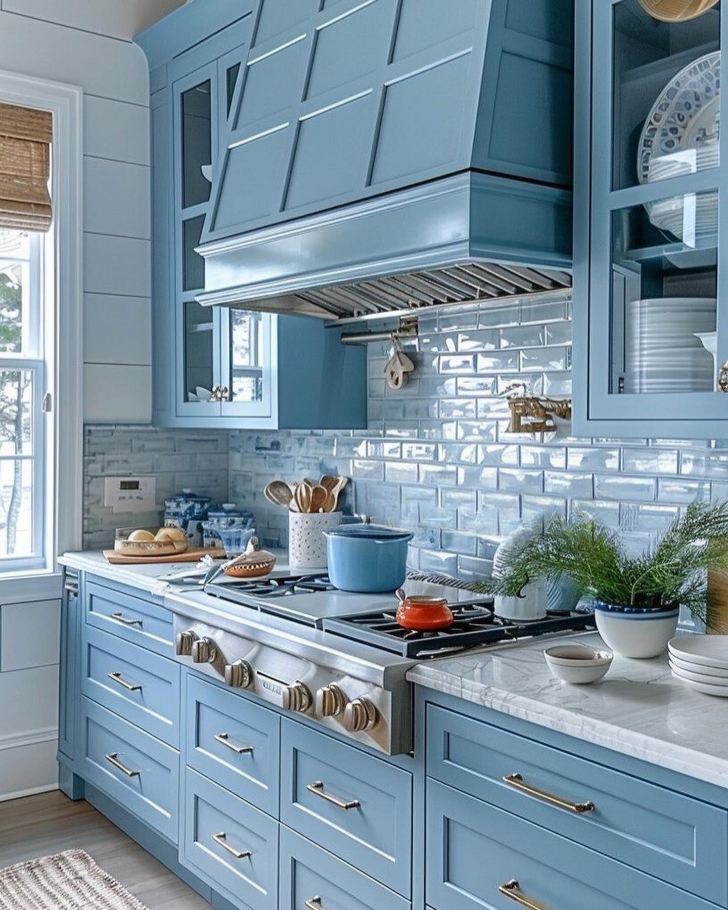 24. Translucent Blue Cabinets and Geometric White Tiles In a Sunlit Kitchen Nook