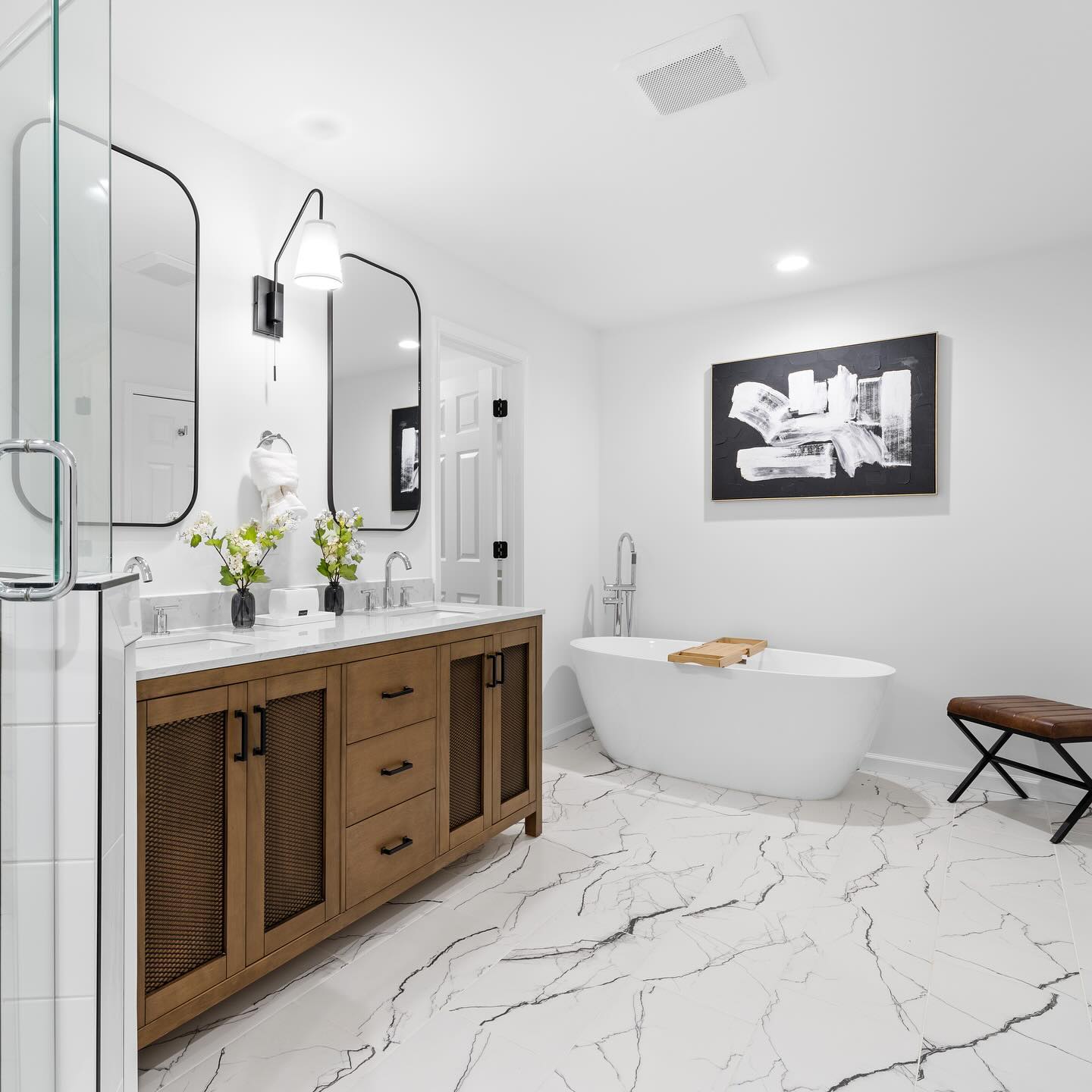 34. Midnight Mosaic: a Black and White Tiled Haven with a Circular Mirror Accent