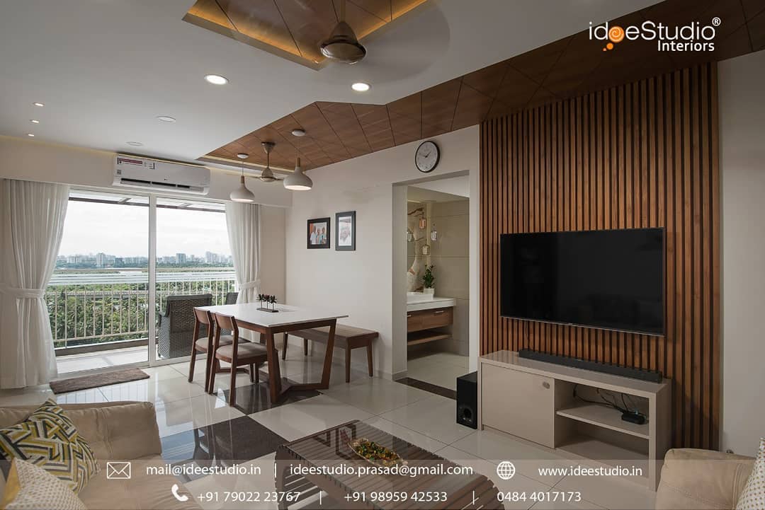 21. the Crimson Velvet Sofa and Geometric Wall Art Fusion