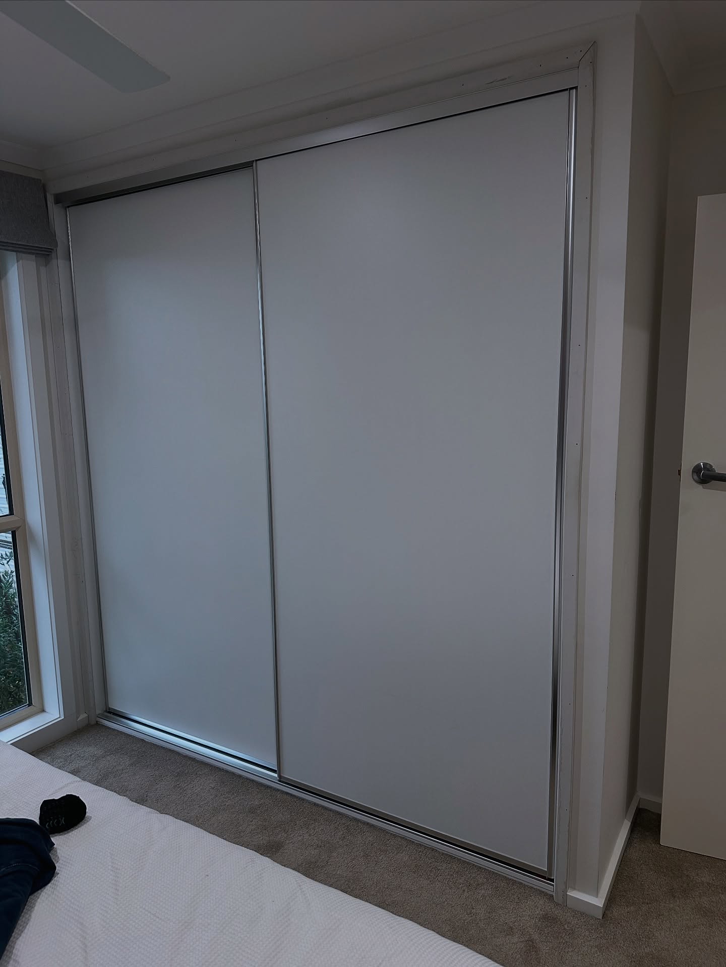 1. a Symphony Of Sliding Doors with Geometric Glass Panels and Warm Wood Tones