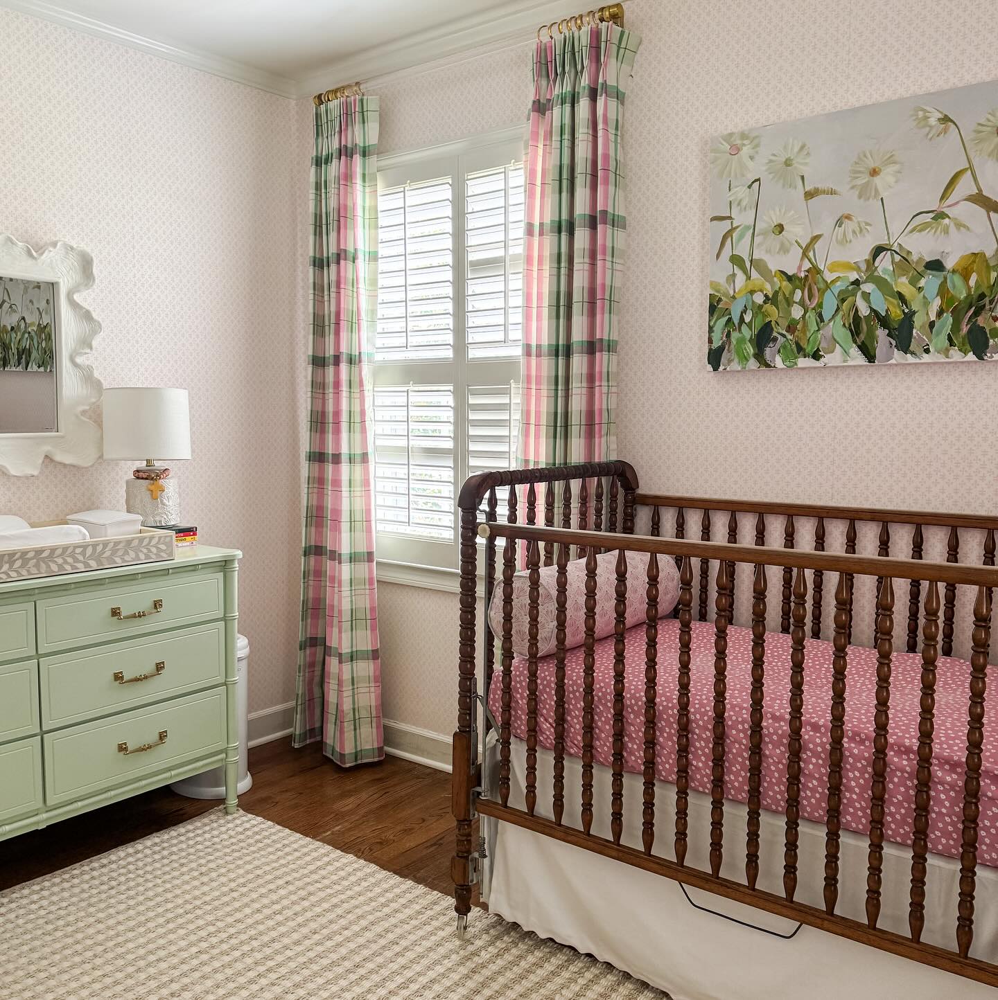 13. Vibrant Floral Wallpaper Meets Soft Pastel Crib In a Whimsical Woodland Retreat