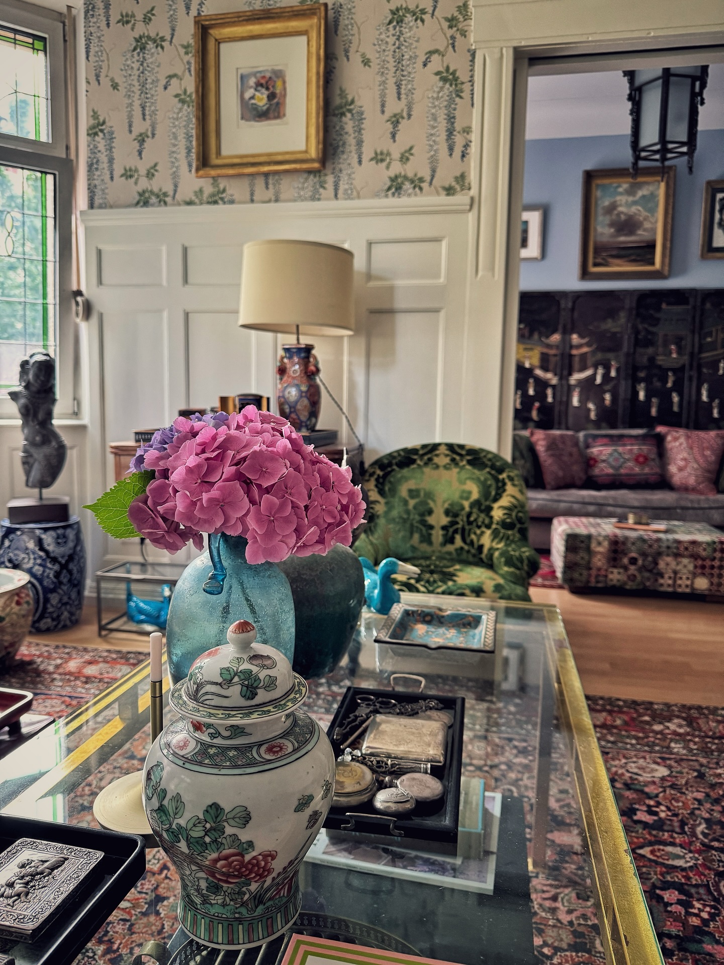 14. Cascading Ferns and Copper Accents on a Reclaimed Wood Surface