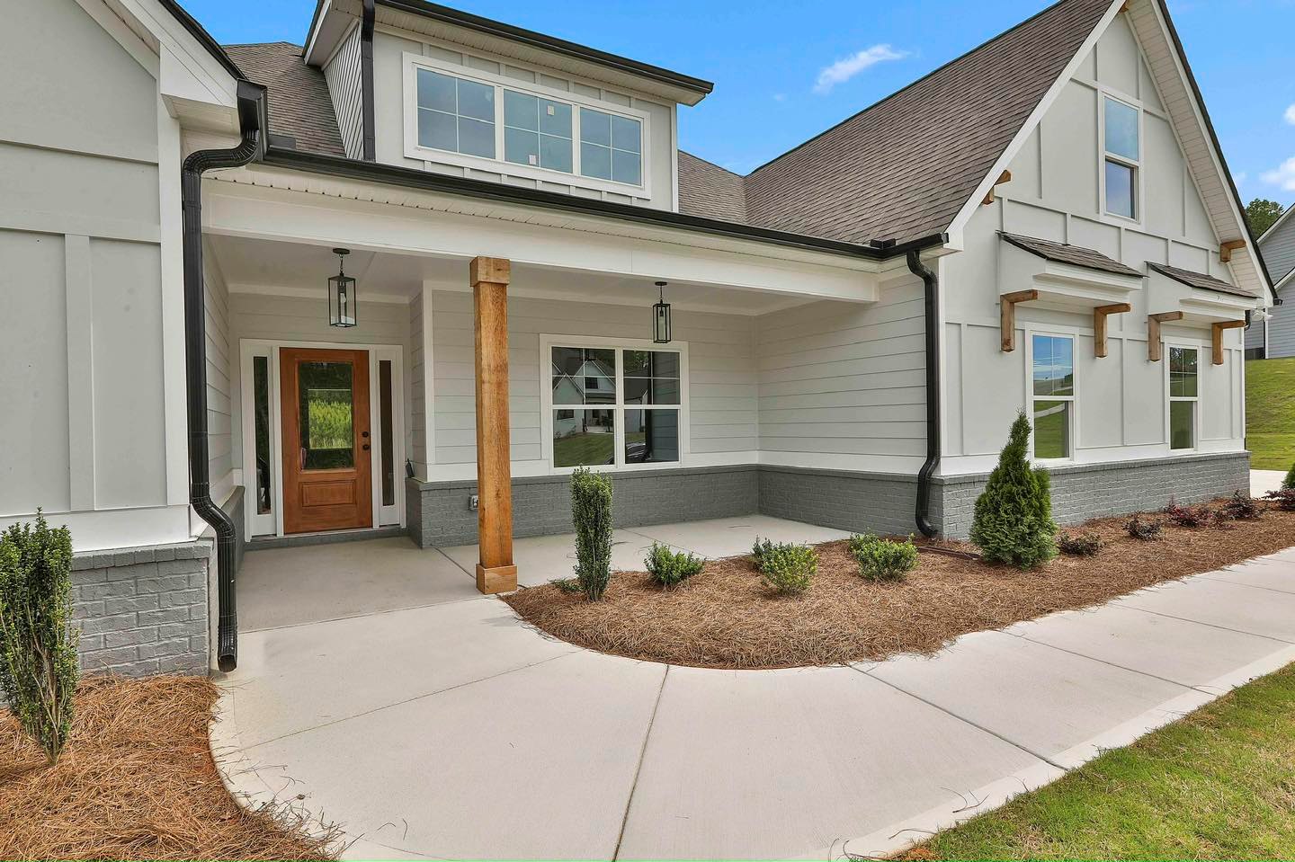 10. Sunlit Terracotta Tiles and Cobalt Blue Shutters on a Ranch Home