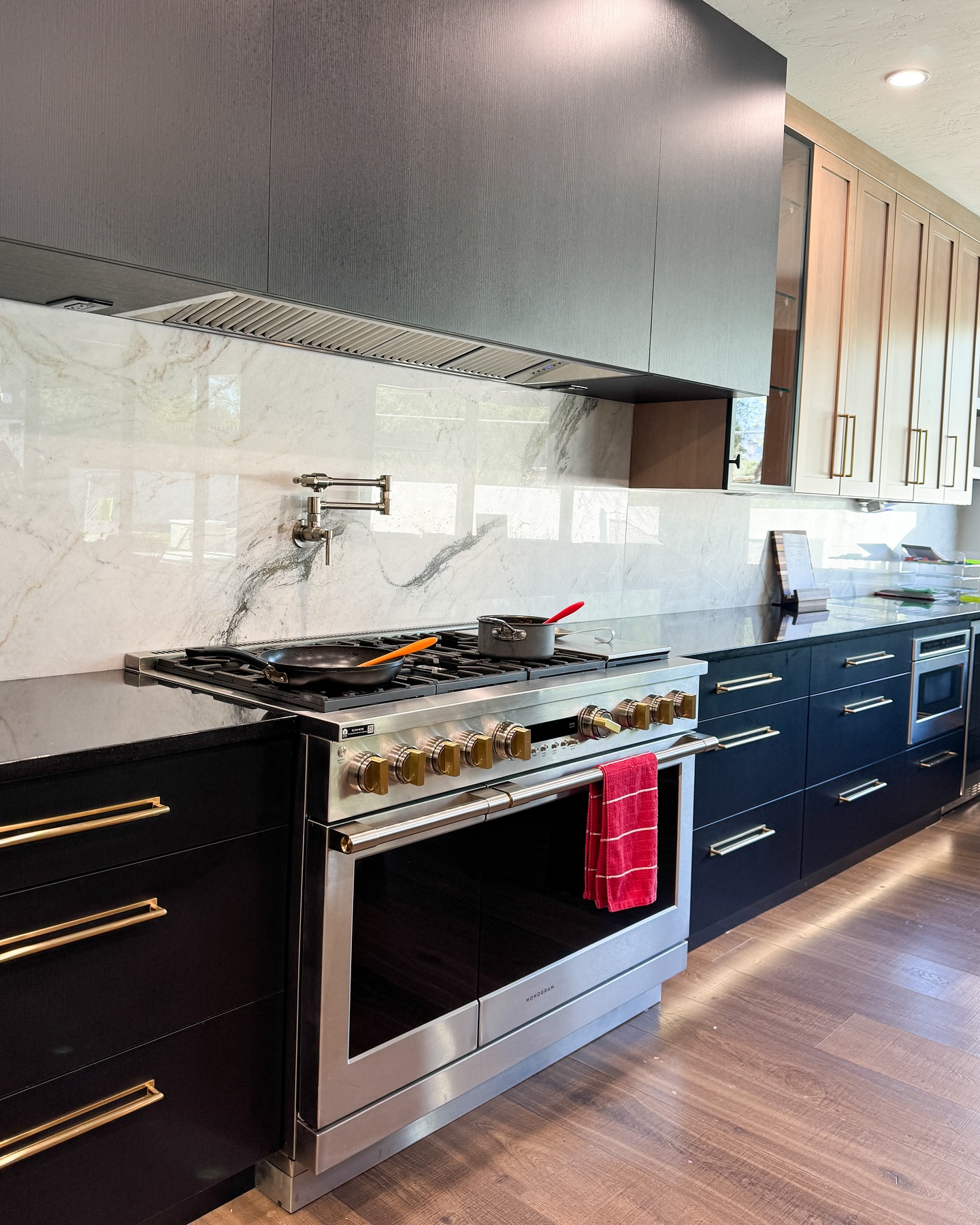 10. the Geometric Dance Of Light and Shadow on Black Cabinets with White Hexagon Backsplash