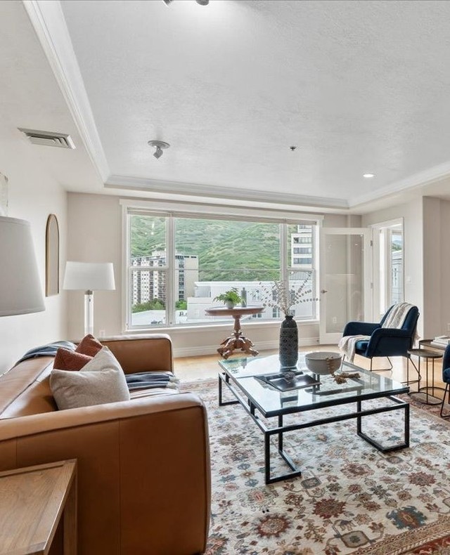 1. Sunlit Serenity: Wicker Furniture and Rattan Ceiling Fans In a Glass-enclosed Retreat