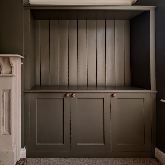 28. the Fusion Of Forest Green and Geometric Patterns In a Compact Wardrobe